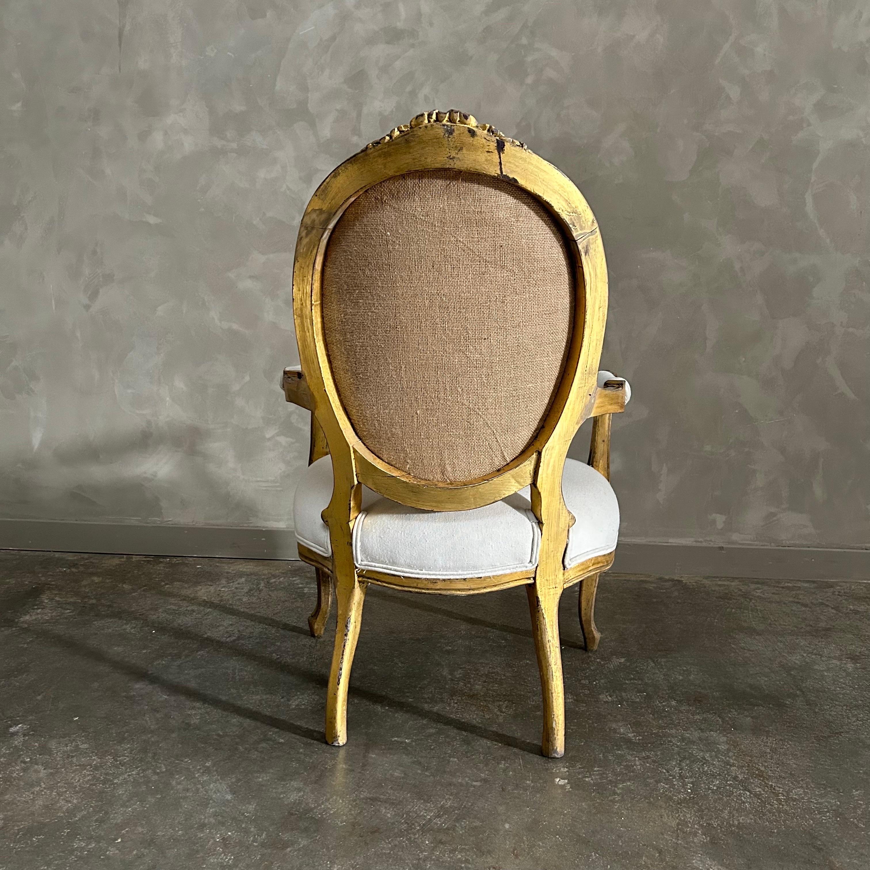 Burlap Vintage Louis XV style open arm giltwood chair For Sale