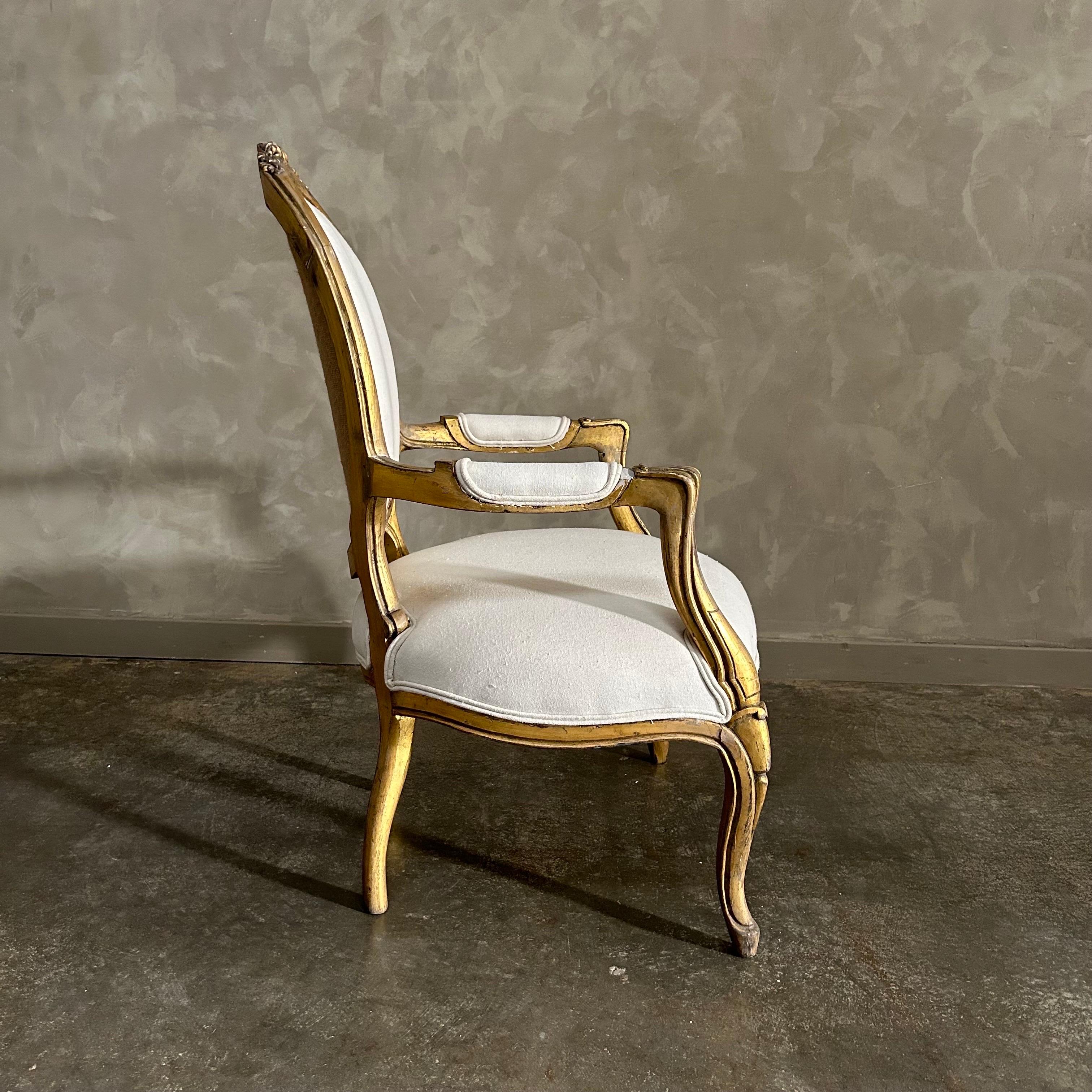 Vintage Louis XV style open arm giltwood chair For Sale 1