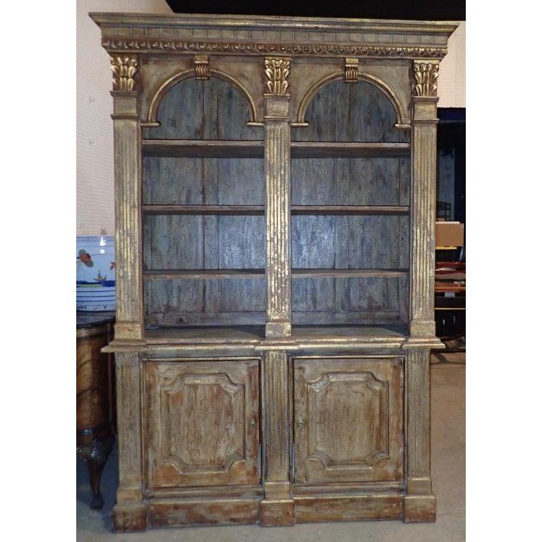 Fine quality vintage gilt and aged wood Bibliotheque, Louis XVI style. It Features two doors and shelving.
