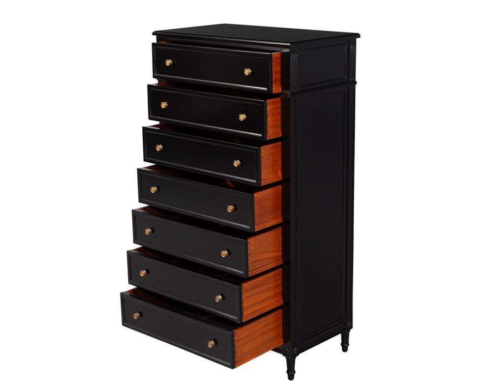 Elevate your living space with this exquisite Vintage Louis XVI Style Tall Chest of Drawers, a striking jewelry and lingerie chest that embodies elegance and sophistication. Crafted in the USA during the 1940s, this stunning piece showcases the
