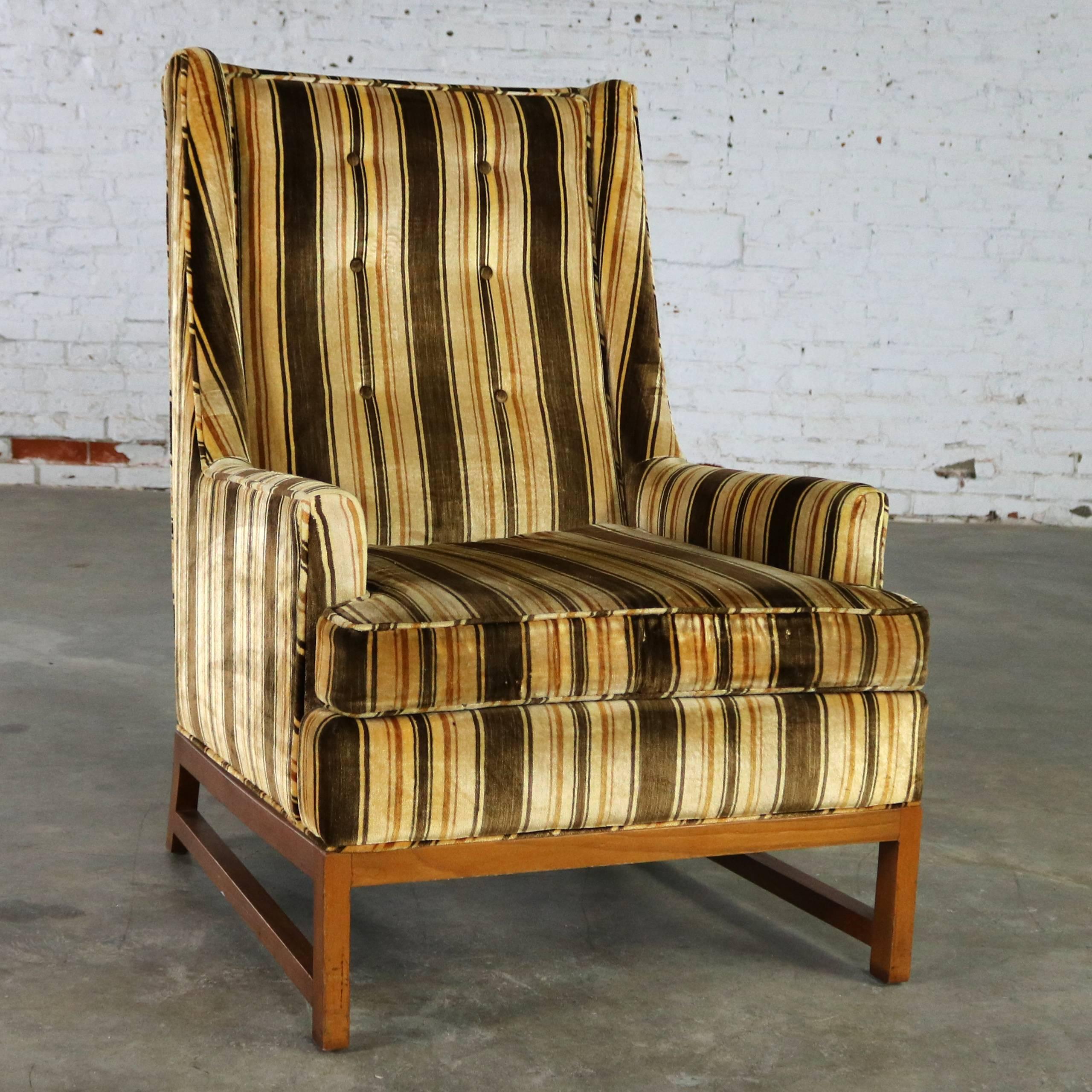 Handsome vintage Mid-Century Modern lounge chair done in the style of Edward Wormley’s Mr. chair for Dunbar. It is in fabulous original vintage condition with its original stripe velvet fabric in the style of Jack Lenor Larsen. There is a small worn