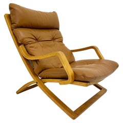 Vintage lounge chair cognac leather with webbing , 1970s