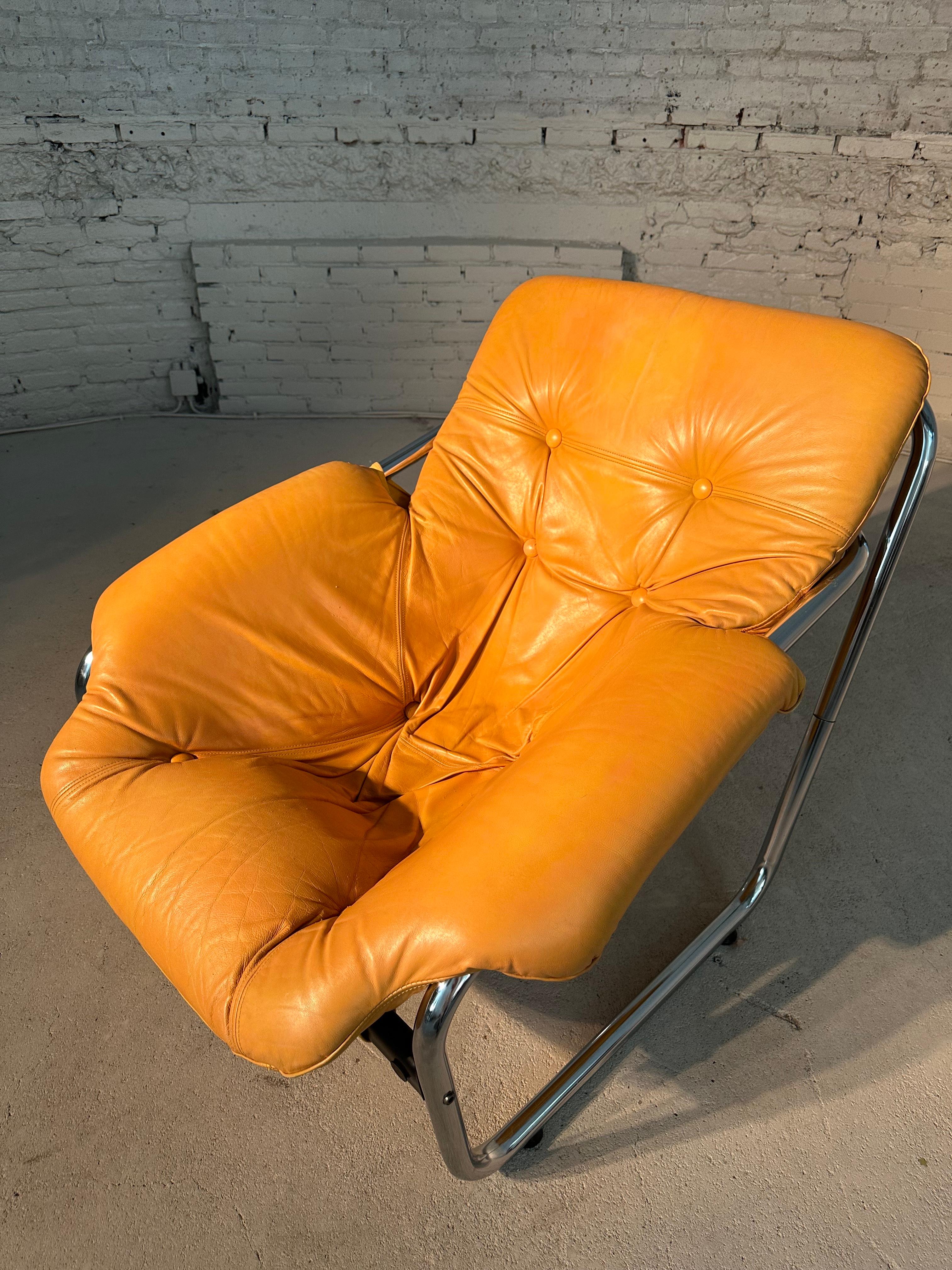 Beautiful vintage armchair in Marcel Breuer style, dating from the 70's. Chromed metal structure and mustard yellow upholstery in perfect condition. Excellent comfort and beautiful vintage line. 

This unique piece was found in a midcentury bungalow