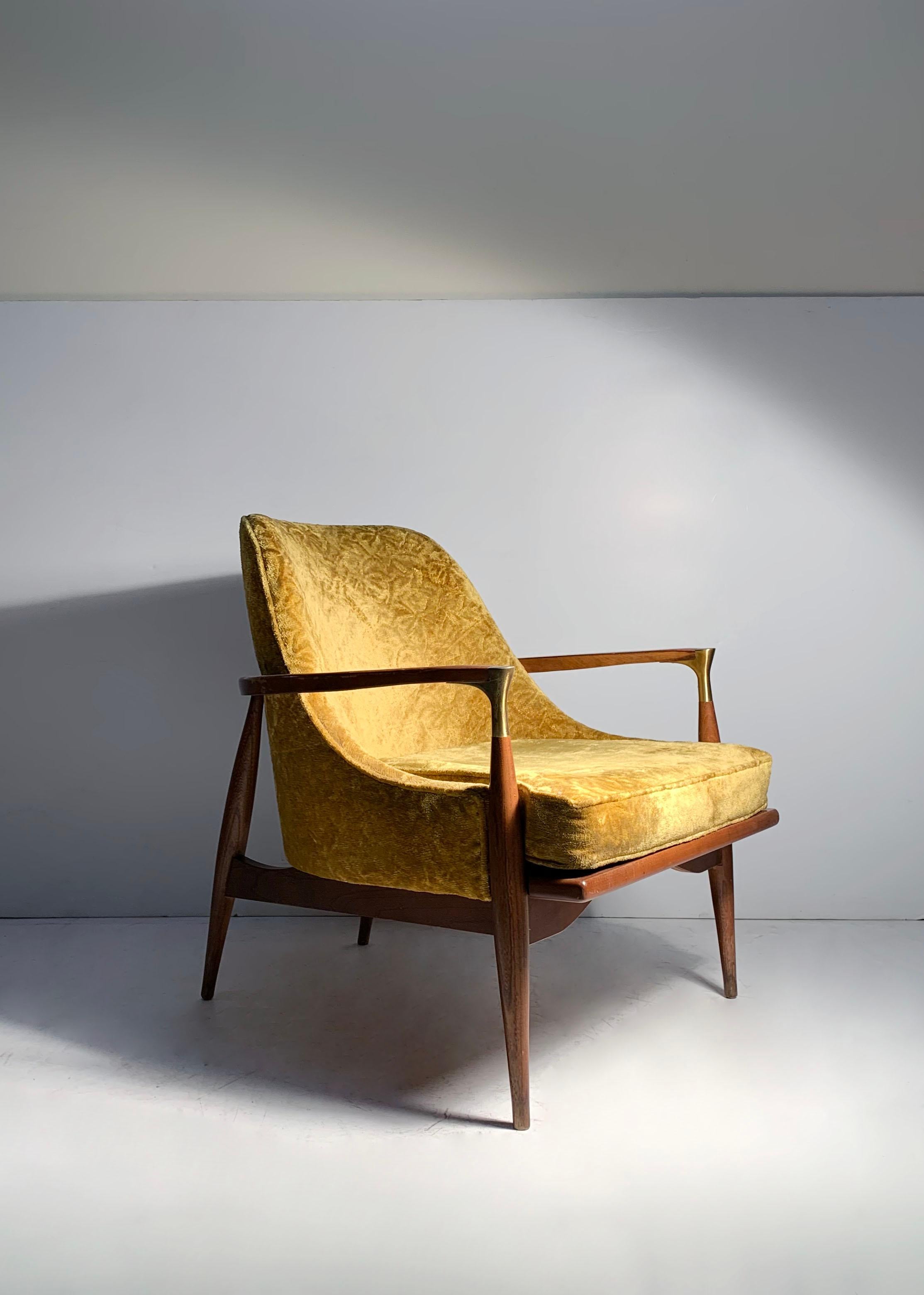 Attractive teardrop seat sitting in a architectural wood frame construction. Brass arm cap detail very nice. Designer and Manufacturer is unknown. Has Danish modern influence. In the manner of Kofod Larsen. Possibly Dan Johnson. Fairly certain these