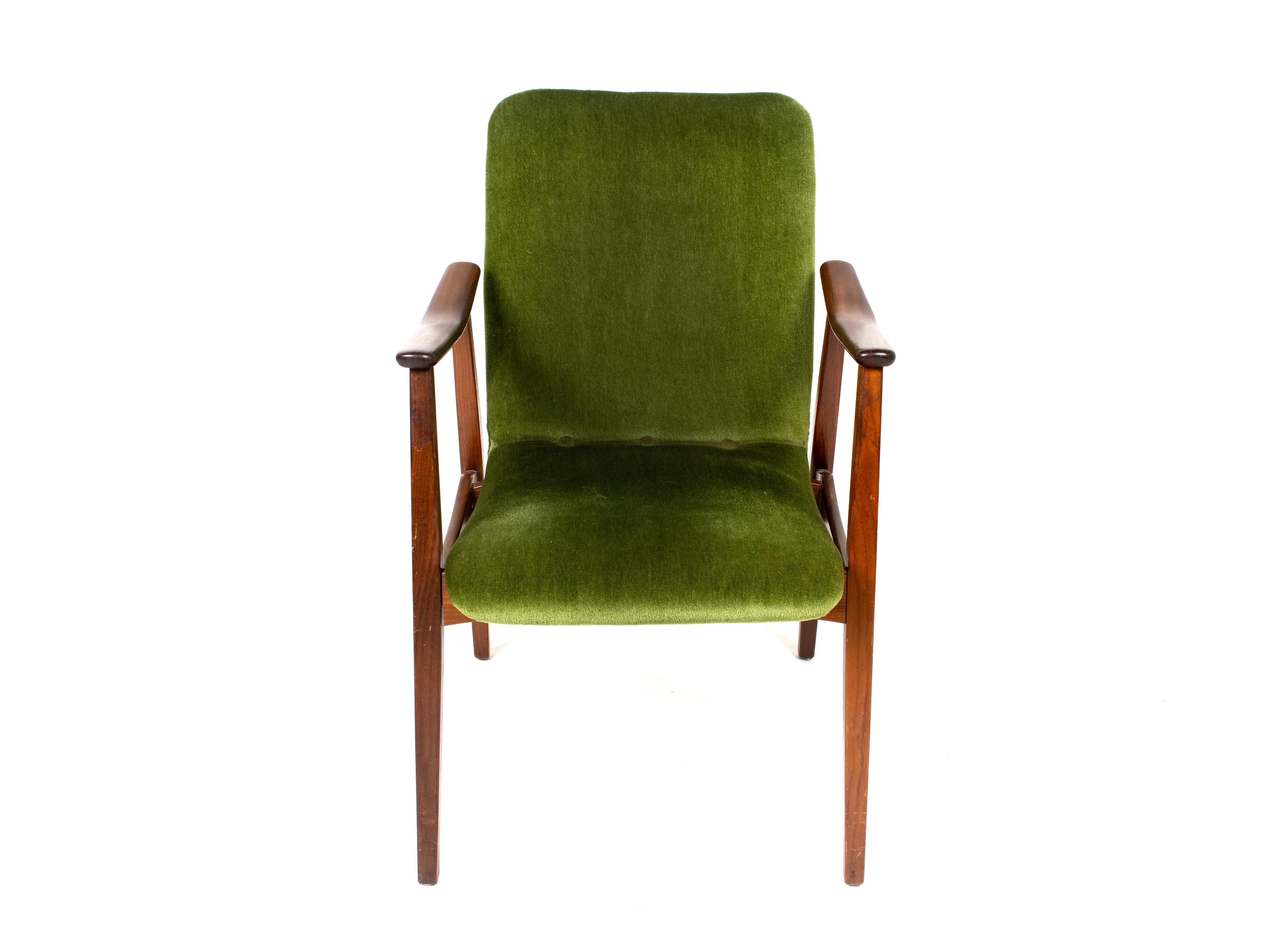 Amazing vintage lounge chair in teak and velvet green fabric. This chair has a design that is very similar to the design of Louis Van Teeffelen and Danish Design of the 1960s. The armrests have a curve and are elegantly shaped. The fabric is warm