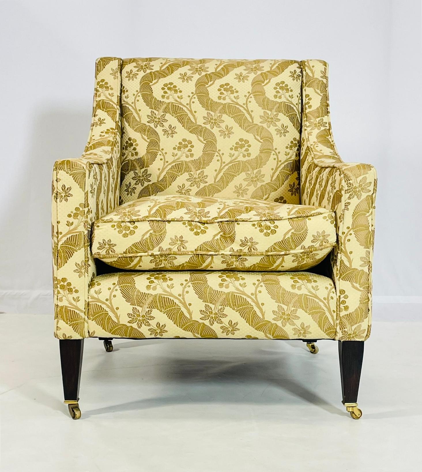 Beautiful lounge chair designed and manufactured in England by George Smith.

The piece is beautifully upholstered in a mustard yellow fabric with beautiful wavy patter.

The chair is hand made out of solid wood, the legs have a dark finish with