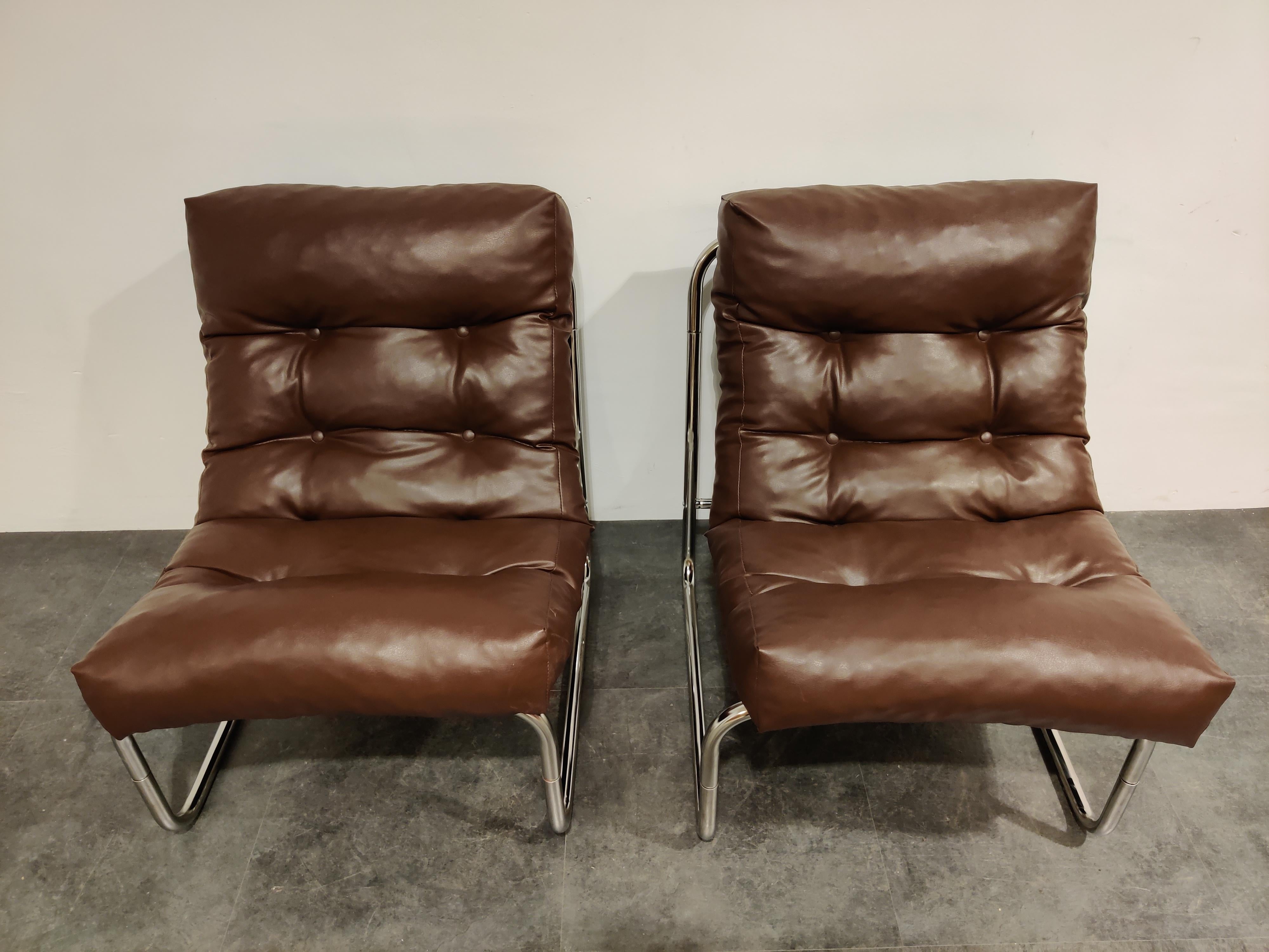 Vintage lounge chairs by famous Ikea designer Gillis Lundgren.

Made of a tubular steel frame with brown faux leather upholstery. 

Very comfortable.

Perfect condition.

1970s, Sweden

Dimensions:
Height 80cm/31.49