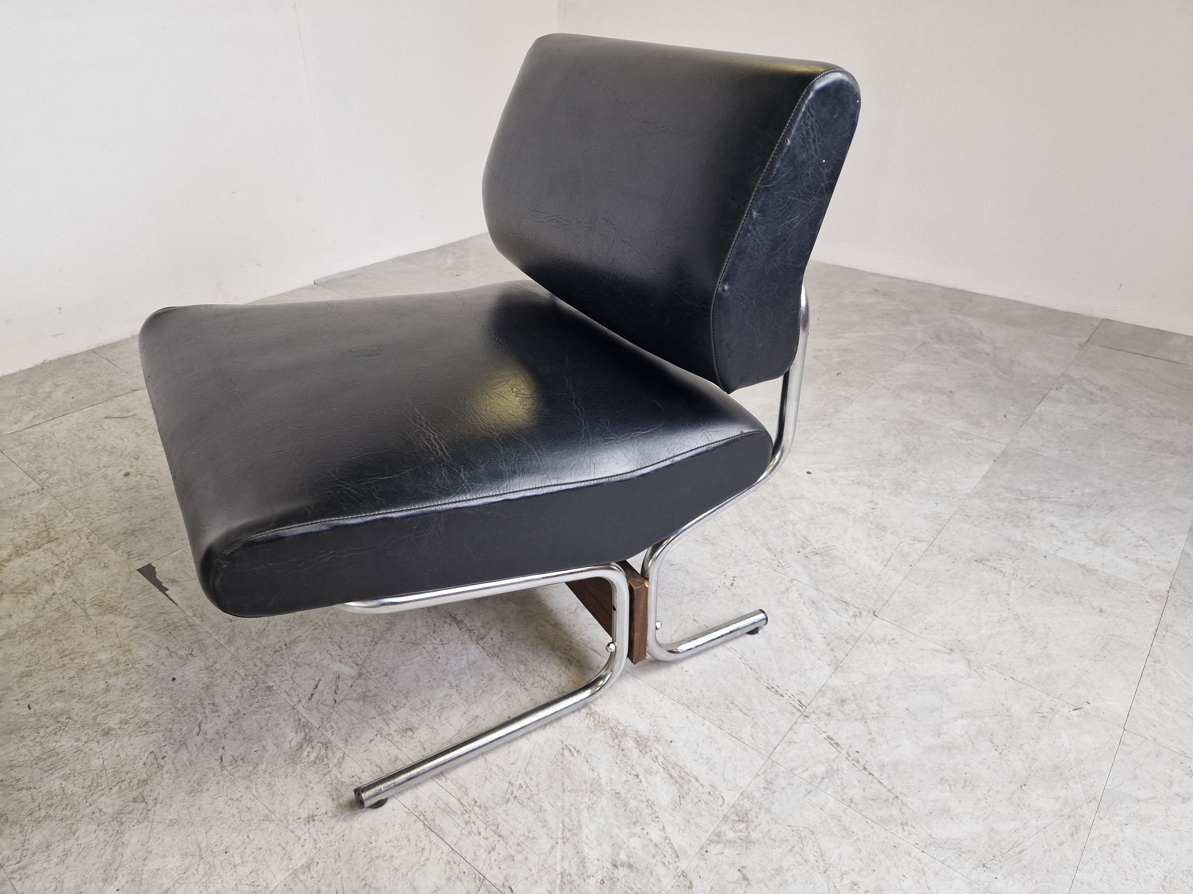 Vintage low chairs model 'caracas' designed by Pierre Guariche for Meurop.

The set consists of 4 identical chairs which can be placed as desired to create one big bench or another setup

The chairs are upholstered in the original black skai and