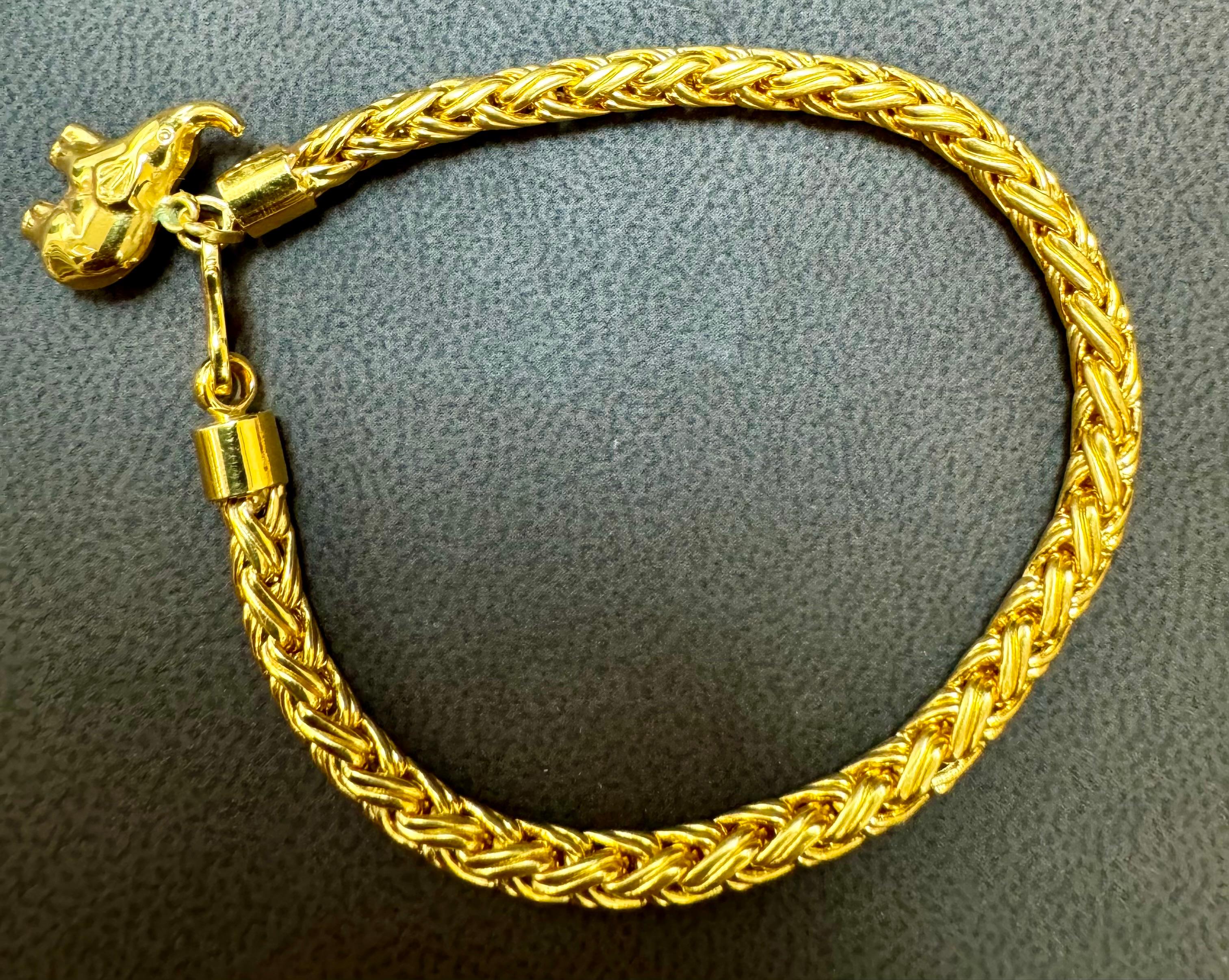This magnificent bracelet is part of the Love Nest collection. Strands of 18kt yellow gold are woven to produce a thick bracelet , and two rondels of smooth 18kt yellow gold  This bracelet is a fabulous accent piece for any occasion.

Crafted from