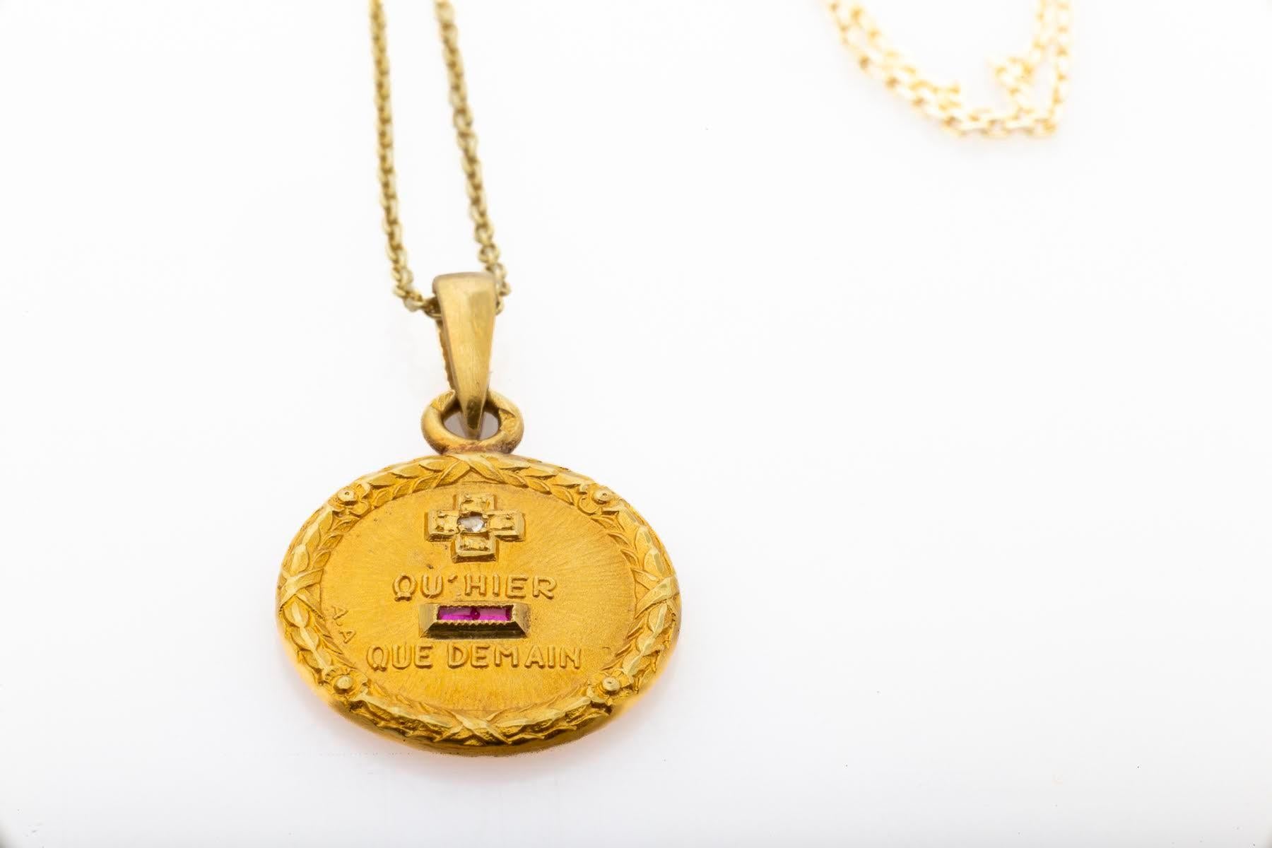 A love pendant by Augis is a combination of romance, history and love. It bridges love from the past to the future. French Augis Love Tokens are not large yet they bring a message of love that is enormous and eternal. In 18kt gold with small rubies