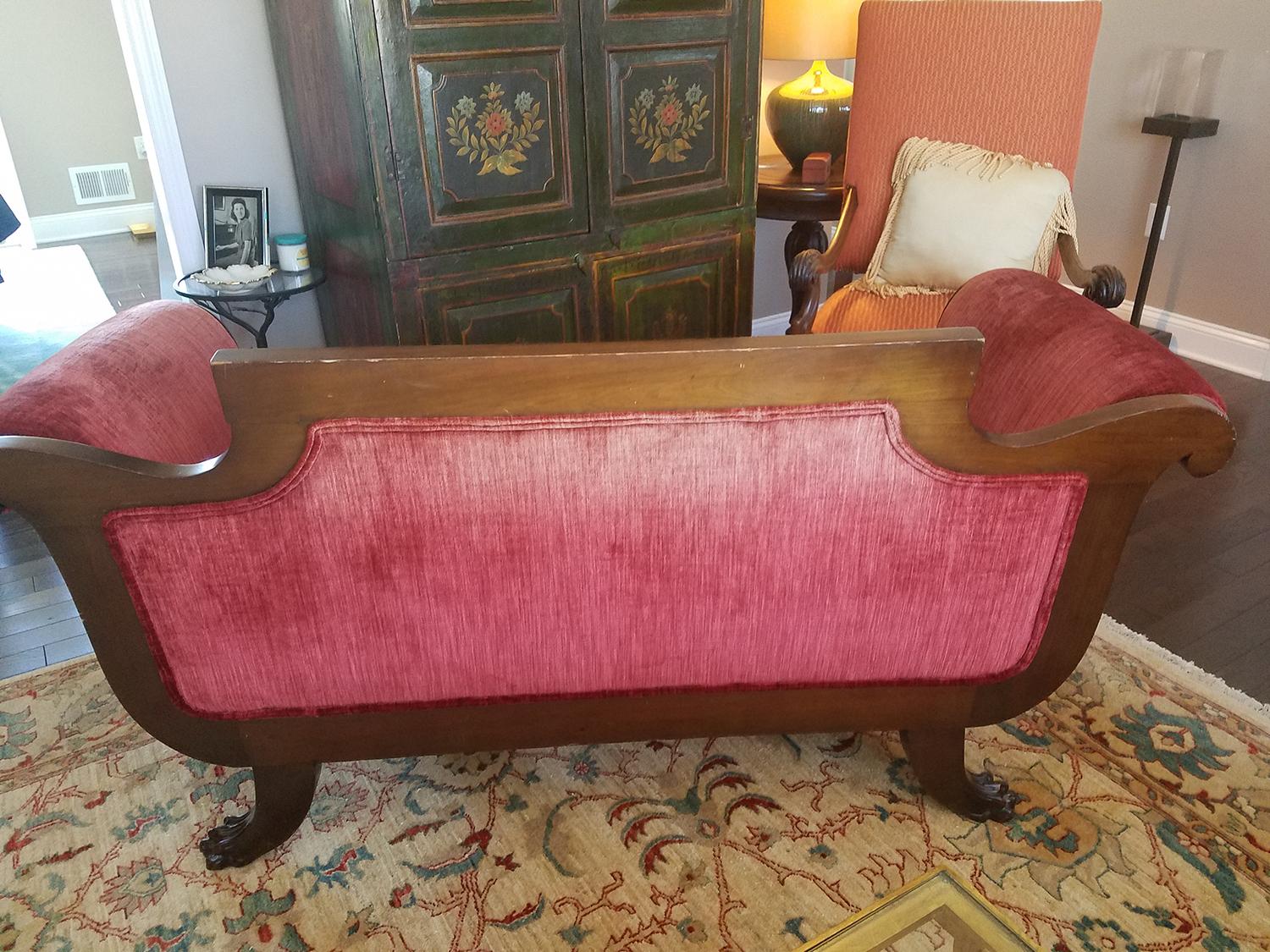 Beautiful carved lion feet loveseat. Upholstered in a rich Italian velvet. There are no rips or worn spots in the fabric but the back is a little faded from the sun. Fitted back and seat with two accent pillows. Please see all photos for detail.