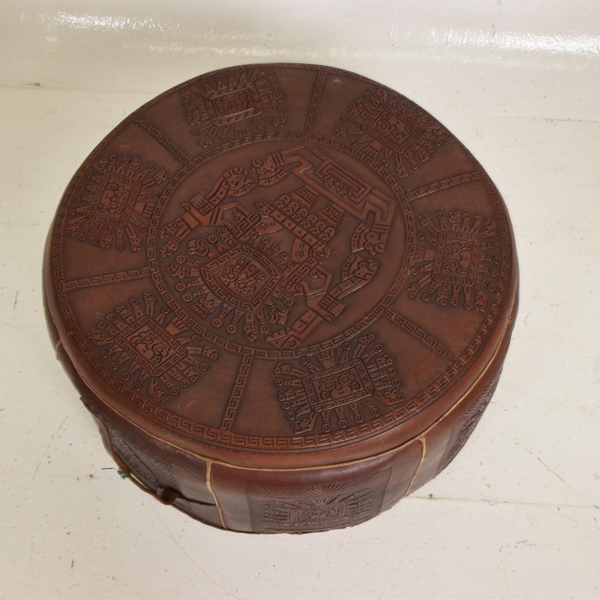 For your consideration a low stool that can be used as a suitcase. Vintage low stool leather suitcase Central American Mayan motif attributed to Angel Pazmino.


Unmarked. 


Dimensions: 21 1/2