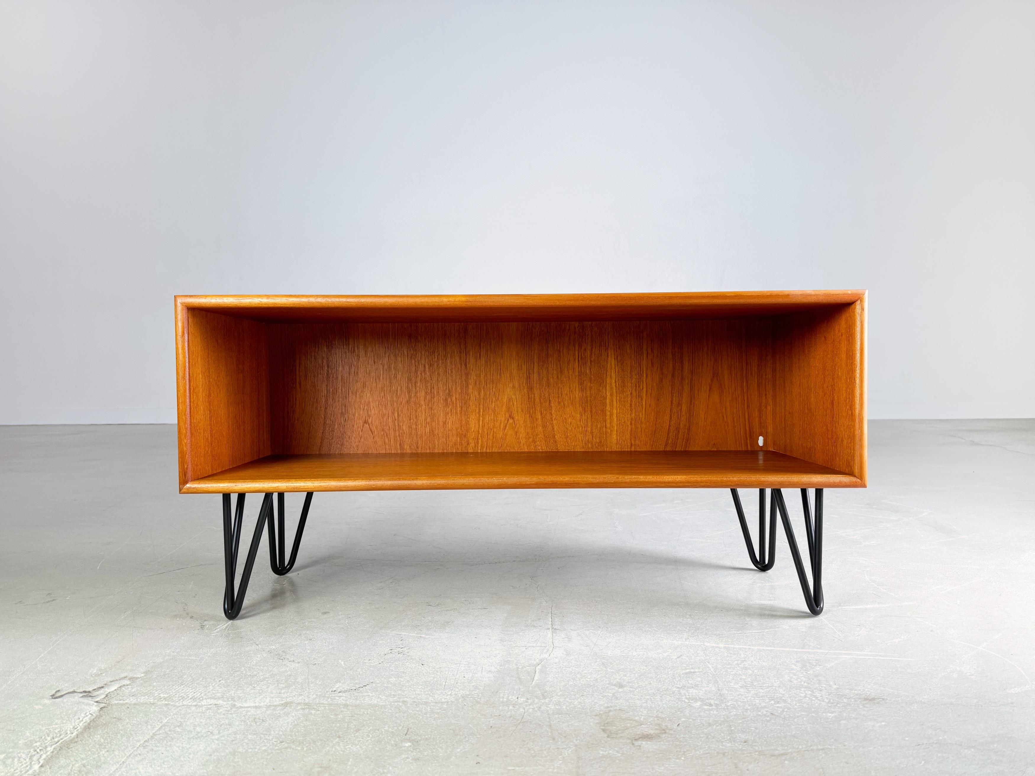 We are offering a beautiful small lowboard by Dyrlund from the 1960s for sale. The wooden module has been professionally refurbished, fitted with hairpin feet and can now be used as a TV board, for example.

Condition: Very good, almost new