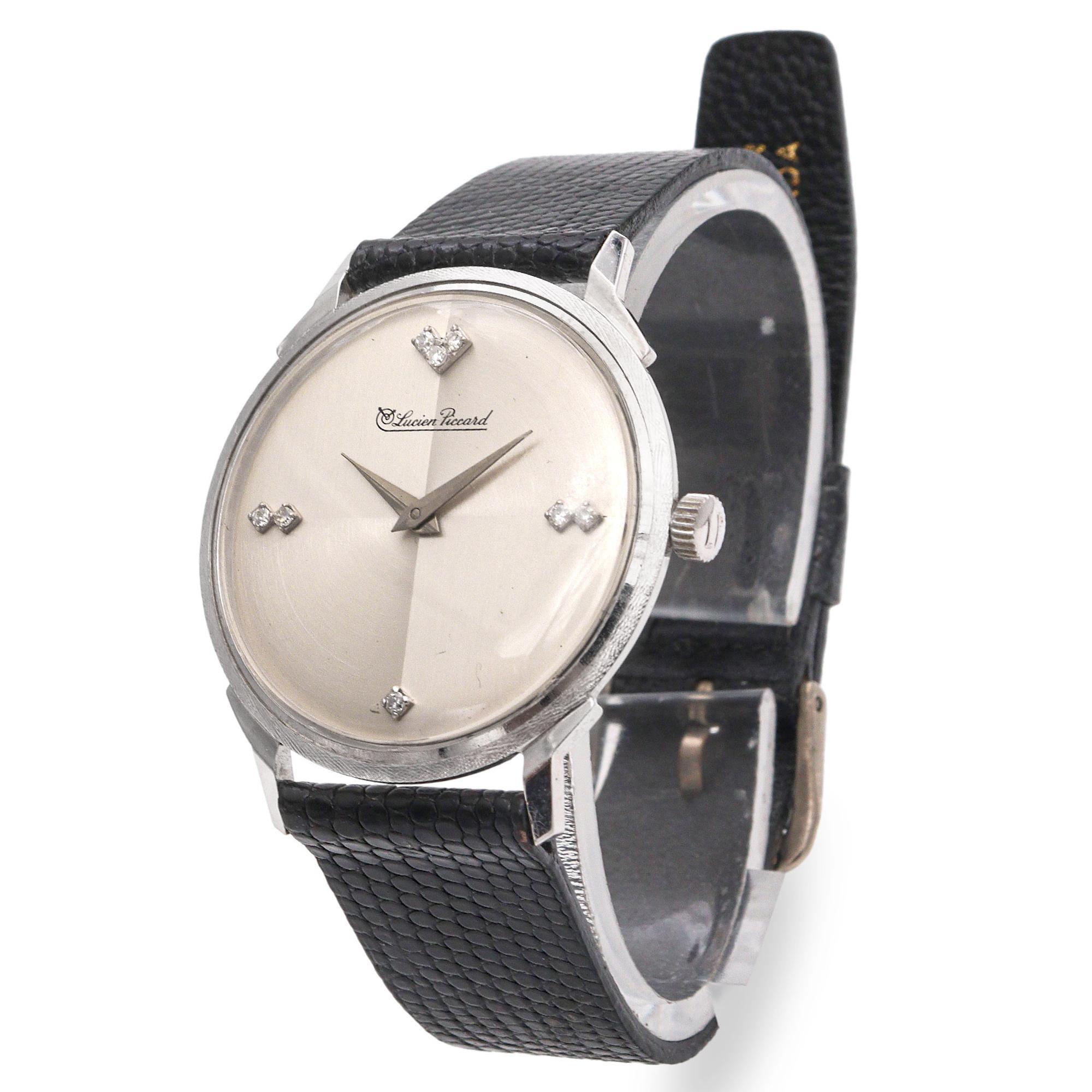 This elegant Lucien Piccard men's watch exudes timeless refinement with its minimalist design and luxurious materials. Crafted in solid 14k white gold, the sleek round case houses a silver-tone sunburst dial adorned with diamond-accented hour