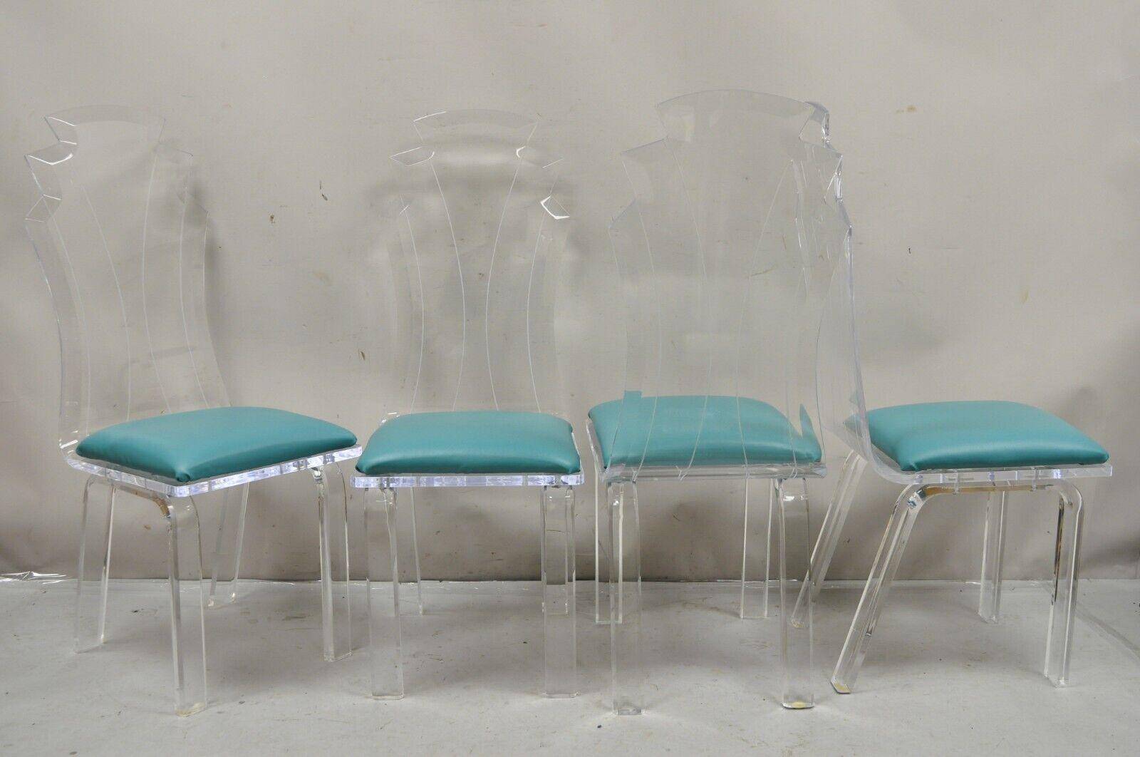 Vintage Hollywood Regency Clear Lucite Acrylic Mid Century Sculptural Dining Table & 4 Chairs - 5 Pc Set. Item features  (4) high back sculptural dining chairs with etched design, heavy thick lucite construction, original teal blue vinyl upholstery,