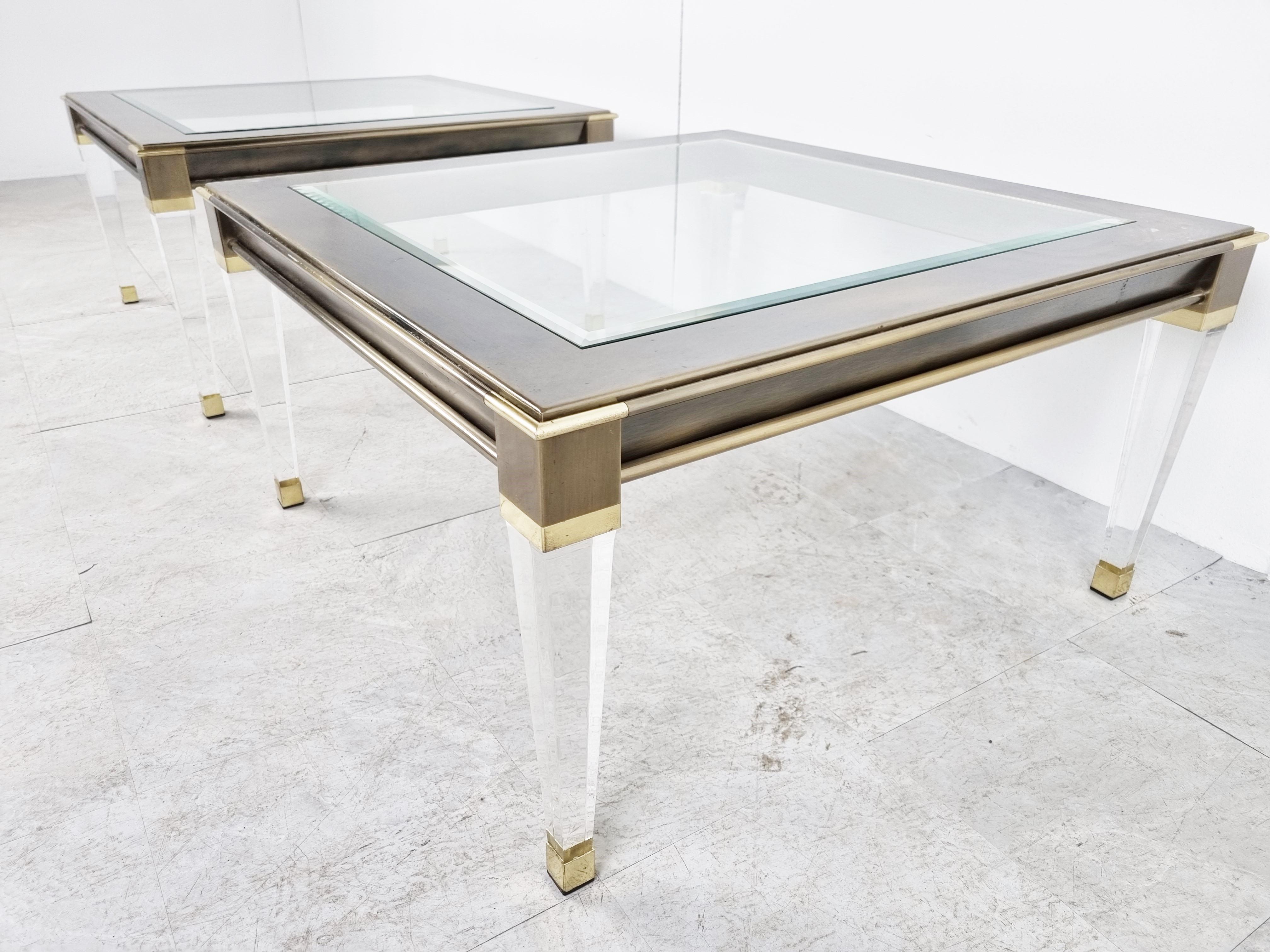 Gorgeous pair of lucite and brass side tables or coffee tables with a clear glass top.

Good overall condition.

These tables where made by Belgochrom, a high end furniture company which no longer exists.

1980s -