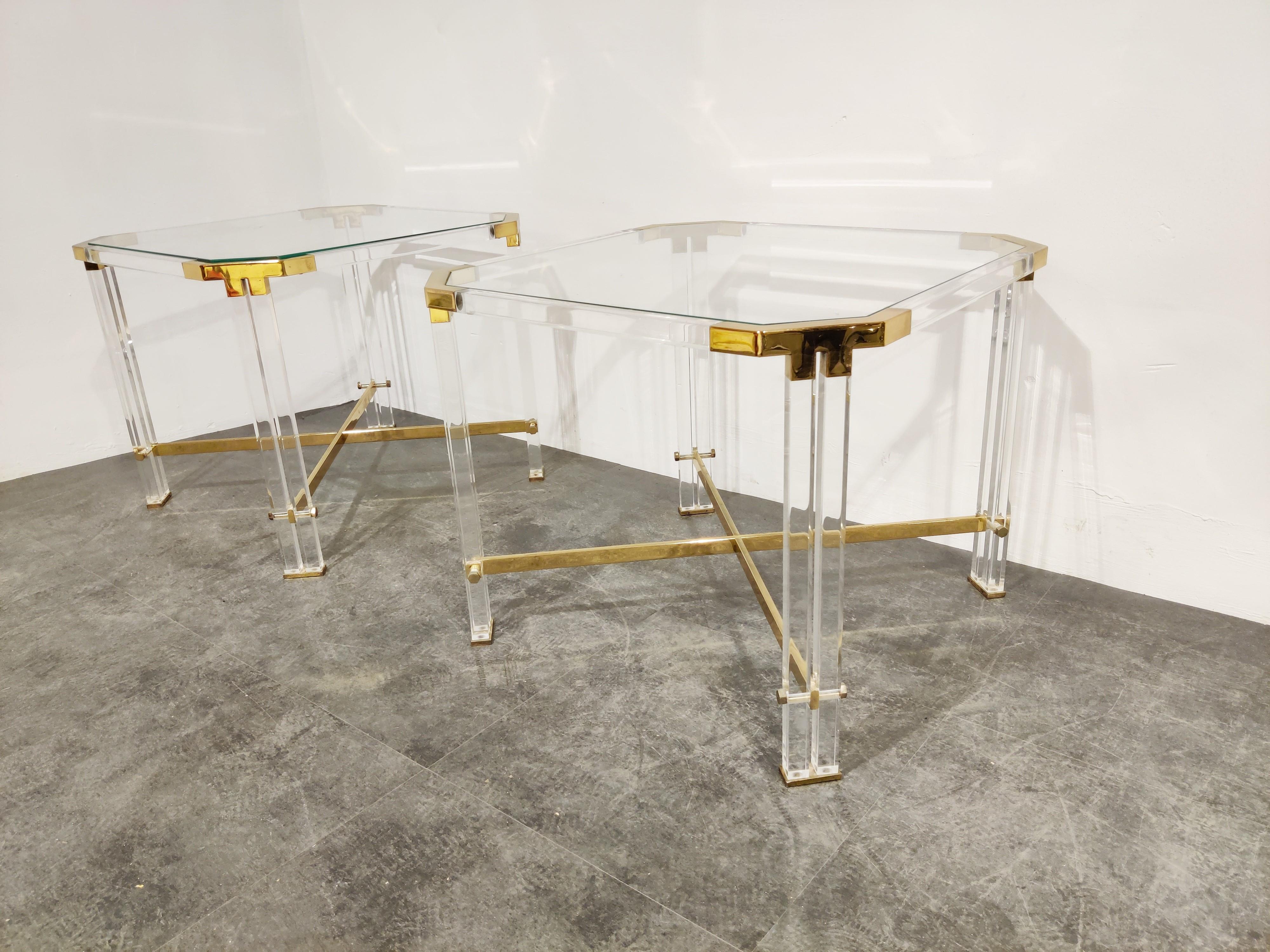 Gorgeous pair of Lucite and brass side tables with a clear glass top by Charles Hollis Jones

Good overall condition.

One of the tables has a small chip in the corner.

1970s - Belgium

Dimensions:

Height 52cm/20.47