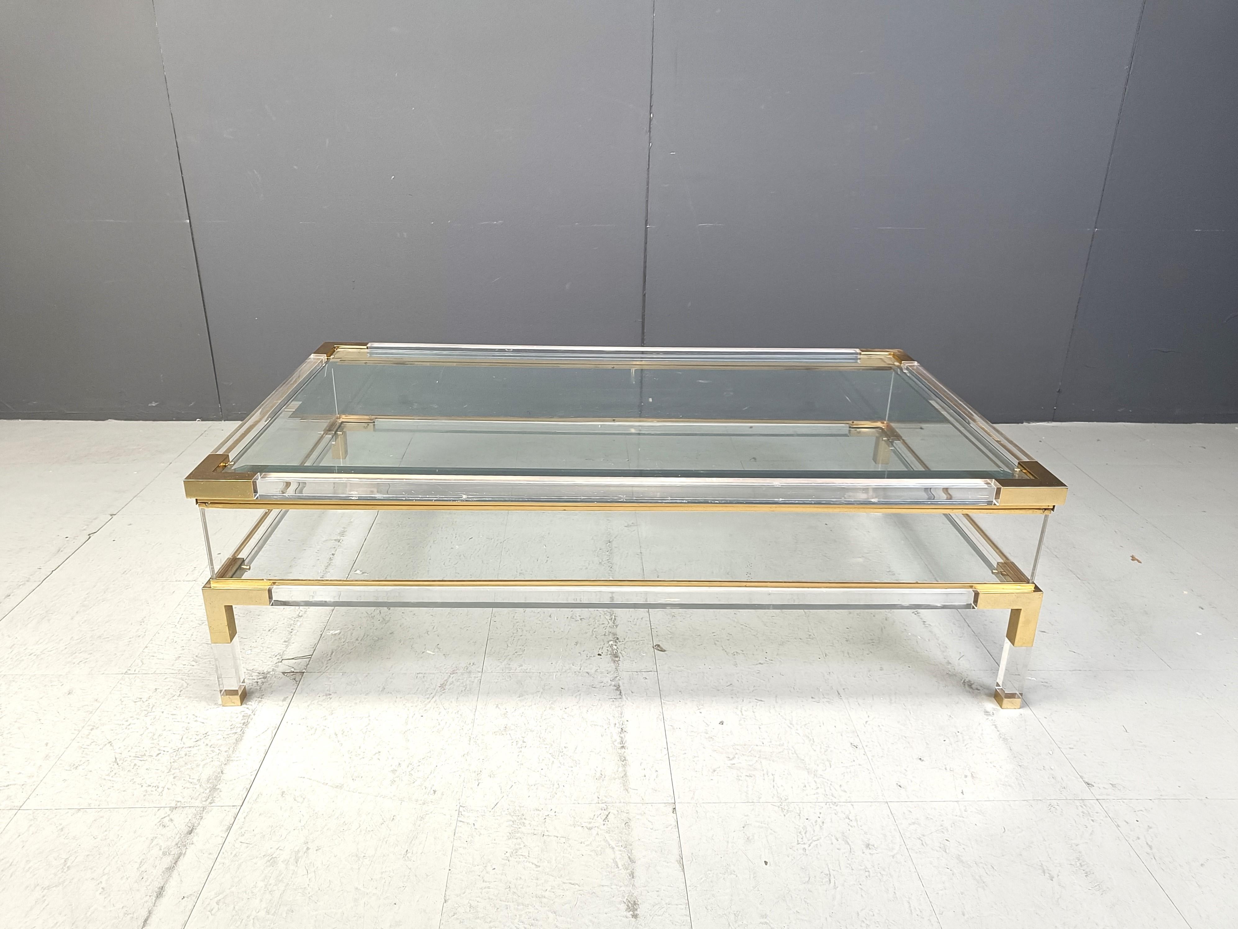 Hollywood Regency Vintage lucite and brass sliding top coffee table, 1970s