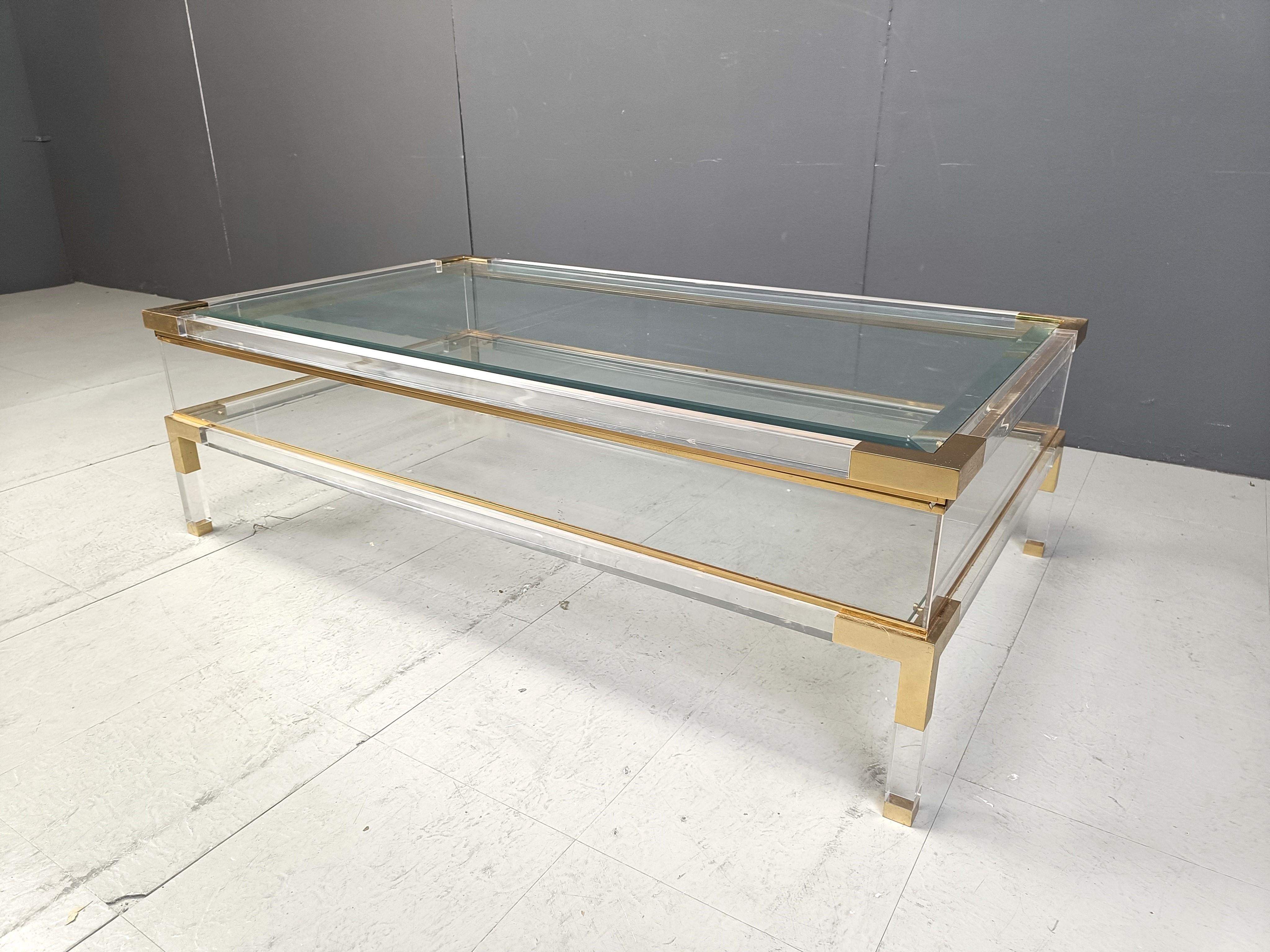 Late 20th Century Vintage lucite and brass sliding top coffee table, 1970s