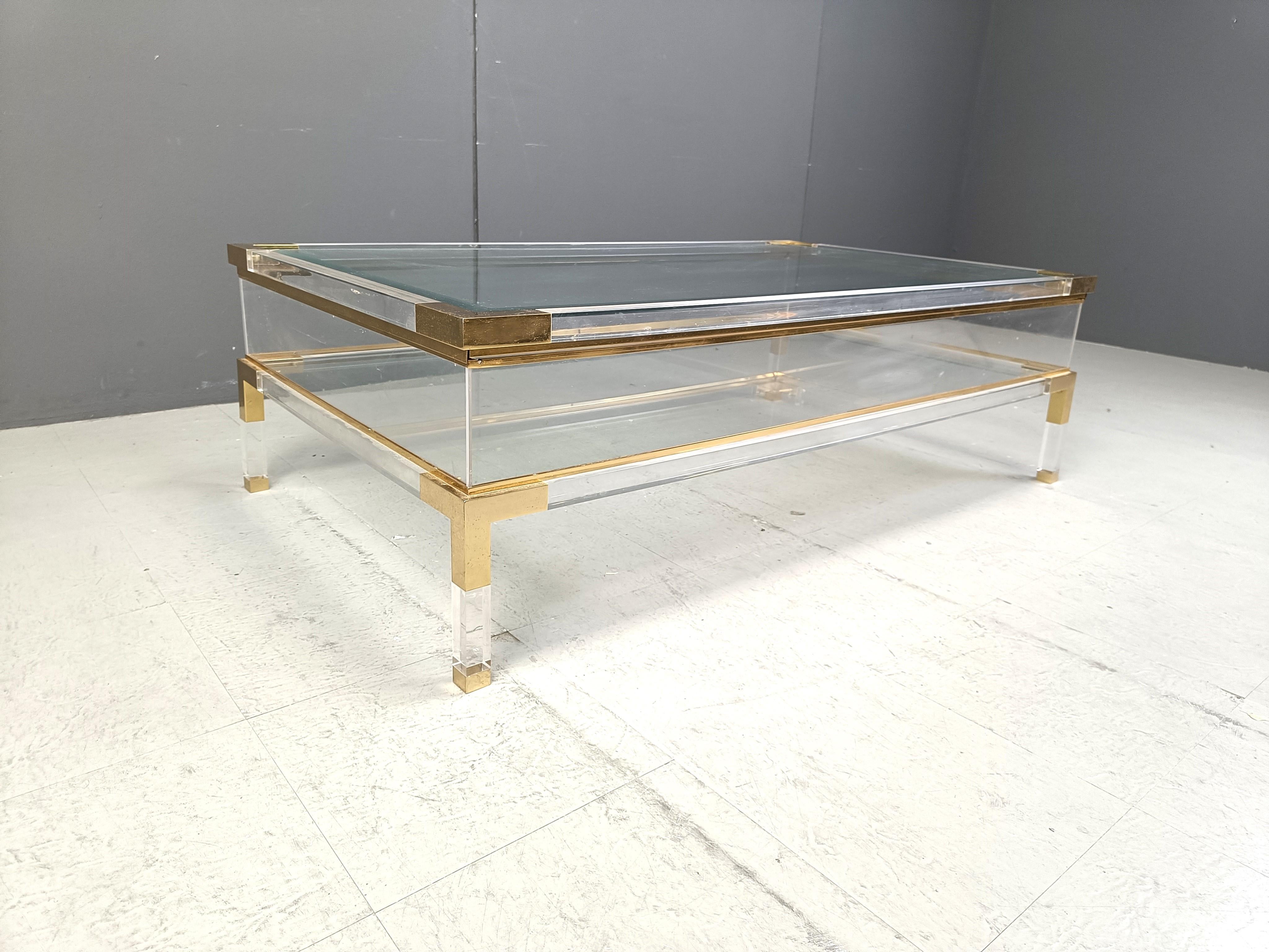 Brass Vintage lucite and brass sliding top coffee table, 1970s