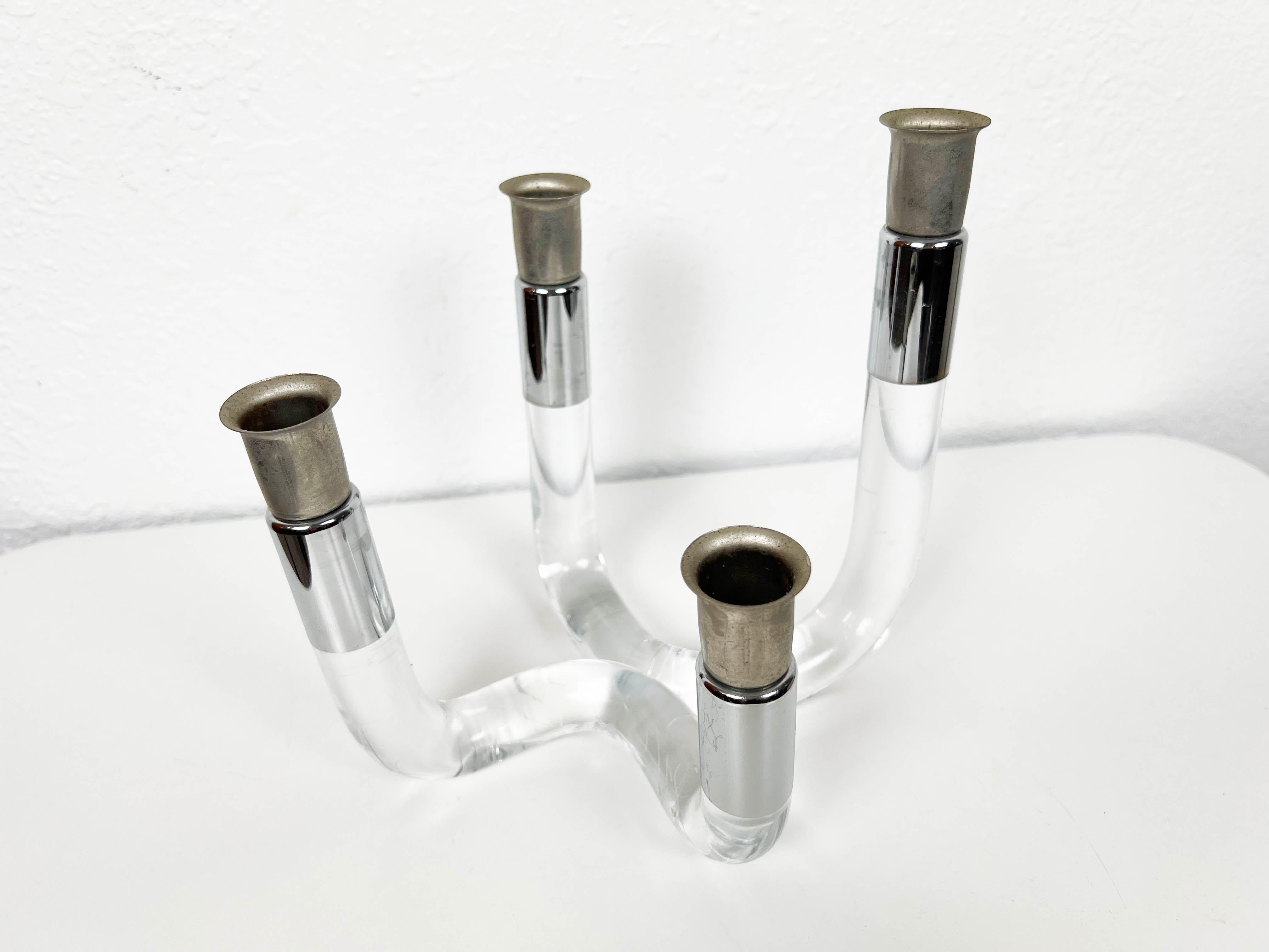 Vintage lucite and chrome candelabra with 4 varied height candlesticks. 

Year: 1970s

Style: Mid-Century Modern

Dimensions: 8