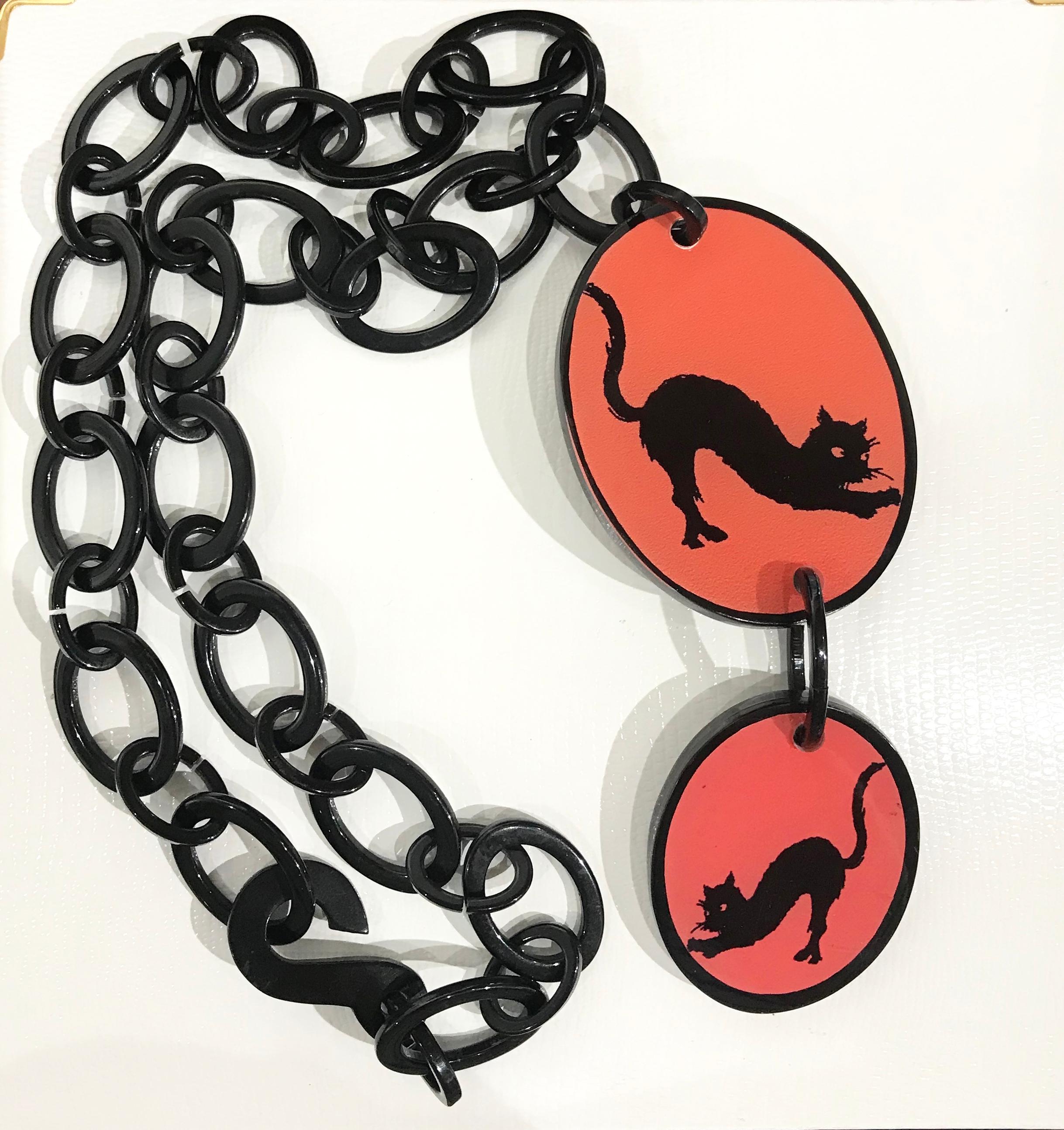 Awesome Double Lucite Pendant each features a Stretching Black Cat on Red background. Approx. sizes of pendants: 2.75” x 2” and 2” x 1.5”; length of link chain: 24”.  So great and just in time for Halloween! 
