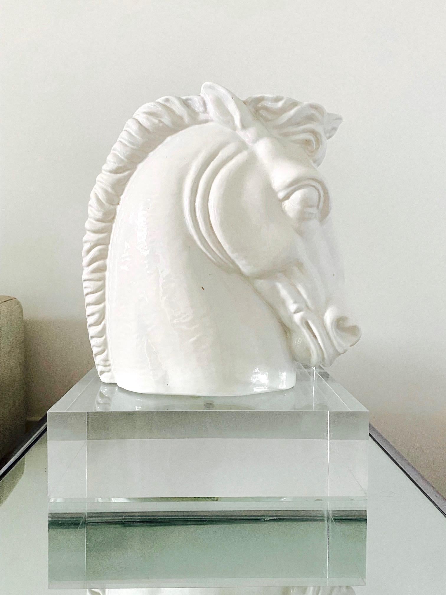 1970's solid lucite riser pedestal base. The base is perfect for display of contemporary art, sculptures, or your favorite antique vase. Completely transparent allowing your art to float wherever it's showcased.