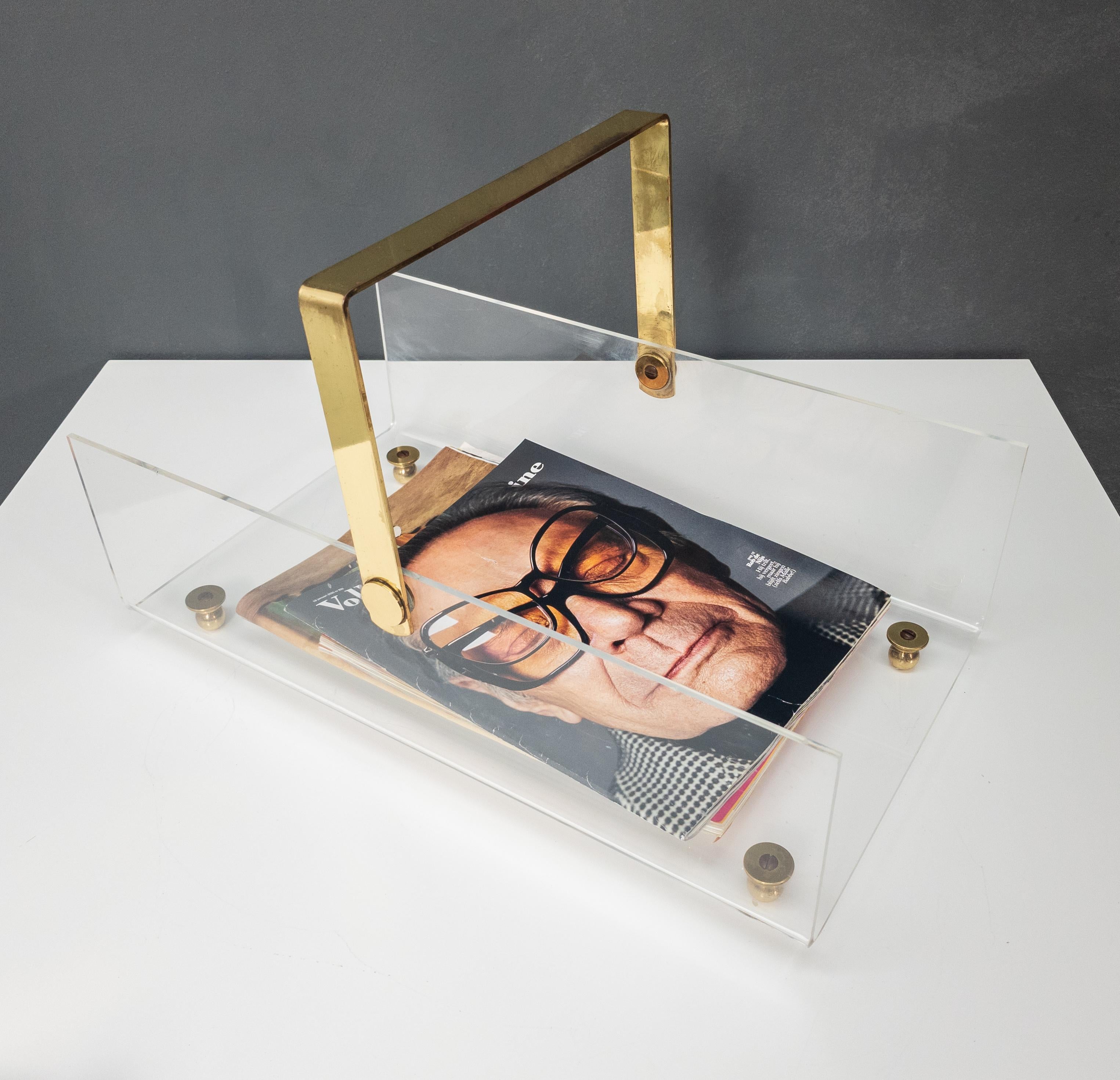 1970s, France

Mid-late 20th century French brass and plexiglass / Lucite magazine rack designed and produced by David Lange (Paul Lange), circa 1970s.

The rack is beautifully designed and proportioned and delivers that harmoniously opulent