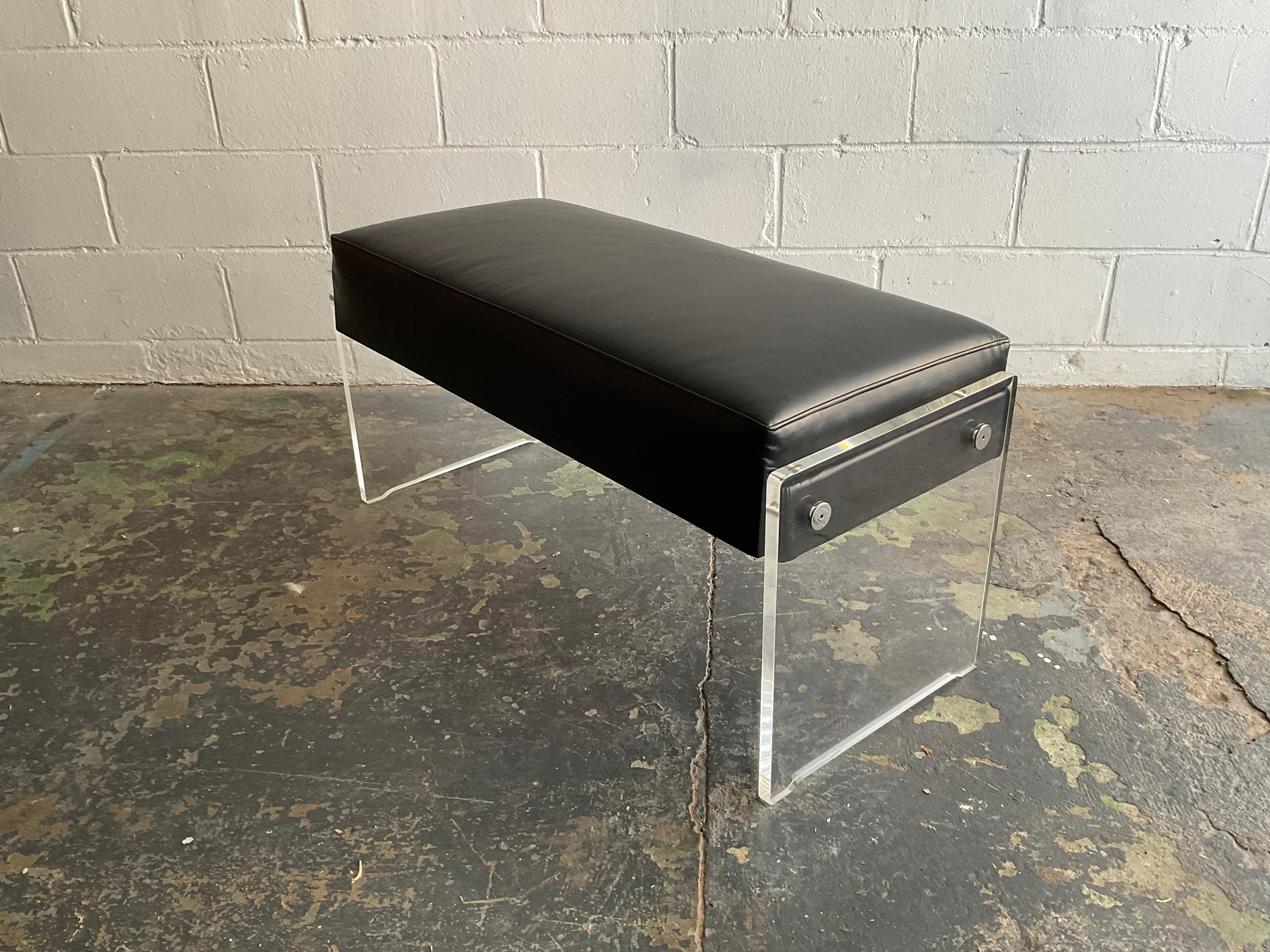 Supremely useful and attractive modern piano or storage bench in lucite with chrome hardware upholstered in a full grain black Italian leather—circa 1980, appearing to be a custom fabrication. Excellent proportions, commodious storage compartment