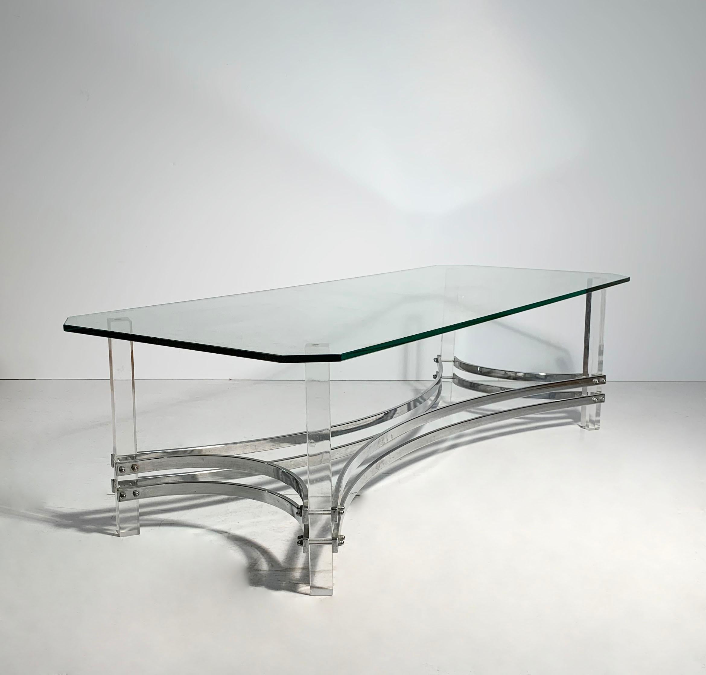 Vintage Hollywood Regency Lucite / chrome coffee table attributed to Charles Hollis Jones. Possibly Italian.