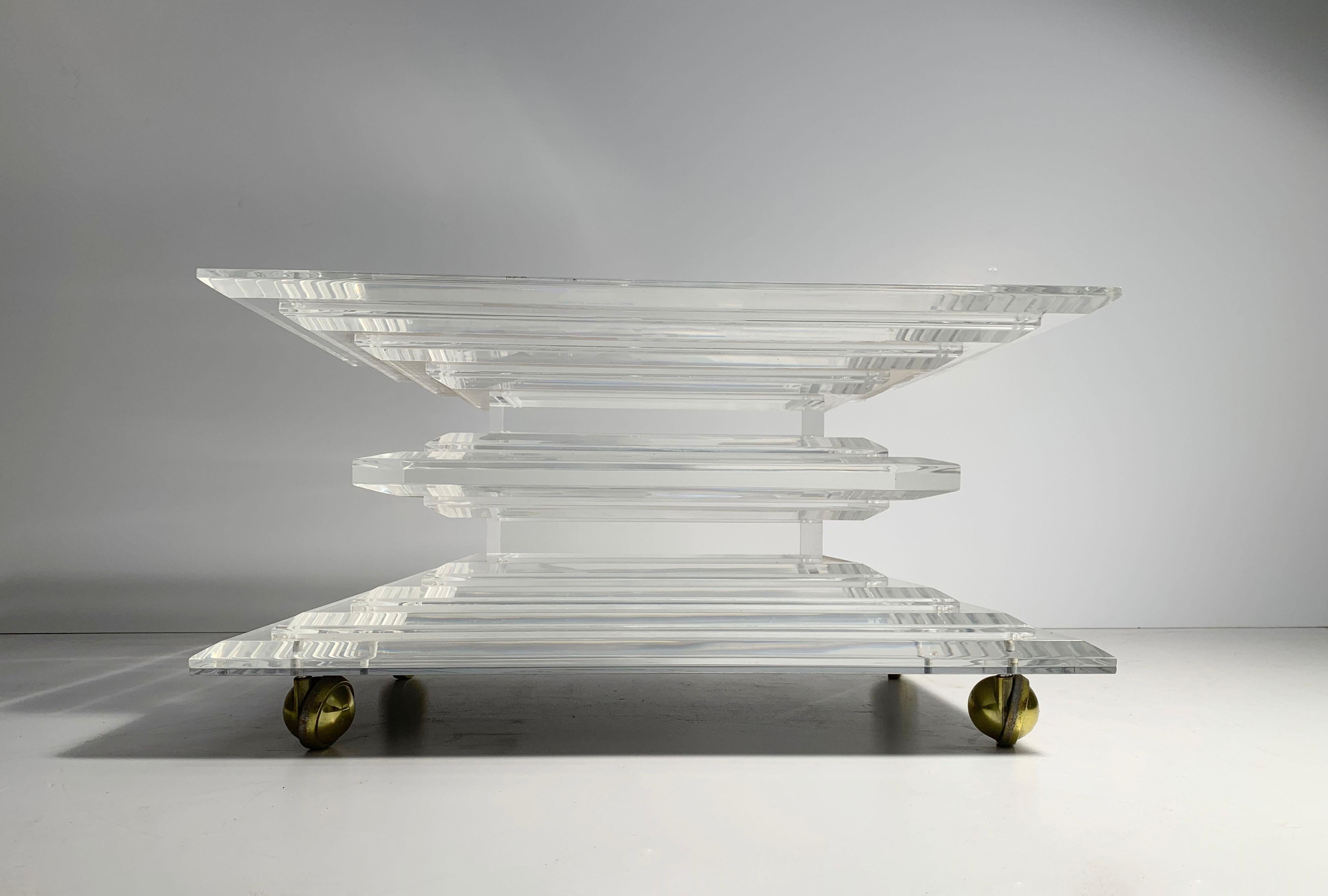 Hollywood Regency Lucite stacked base on castors. Made add a glass top to your design specs for a coffee table. Or, upholster the top for a stellar rolling pouf / stool / bench

Manner of Karl Springer

Size of base is
28