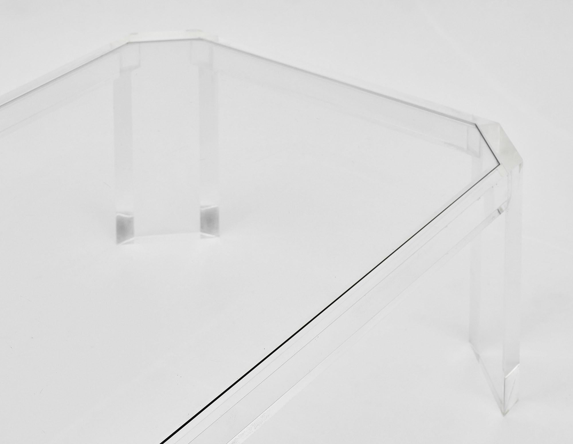 Coffee table from France made of Lucite with a glass top. The Lucite structure has been professionally polished.