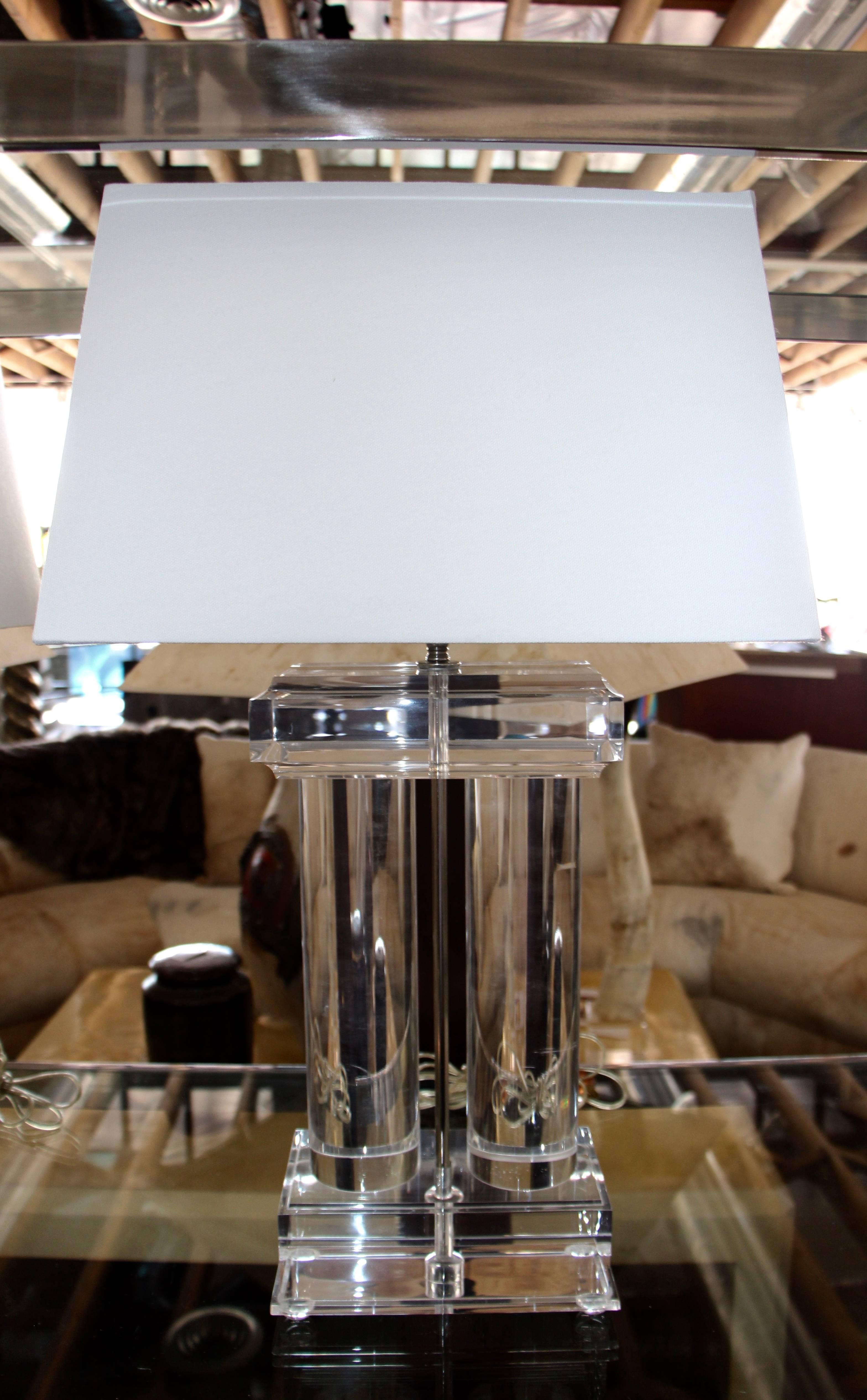 A nice pair pf vintage Lucite column lamps. These lamps have some minor crazing, and imperfections, from age and wear.