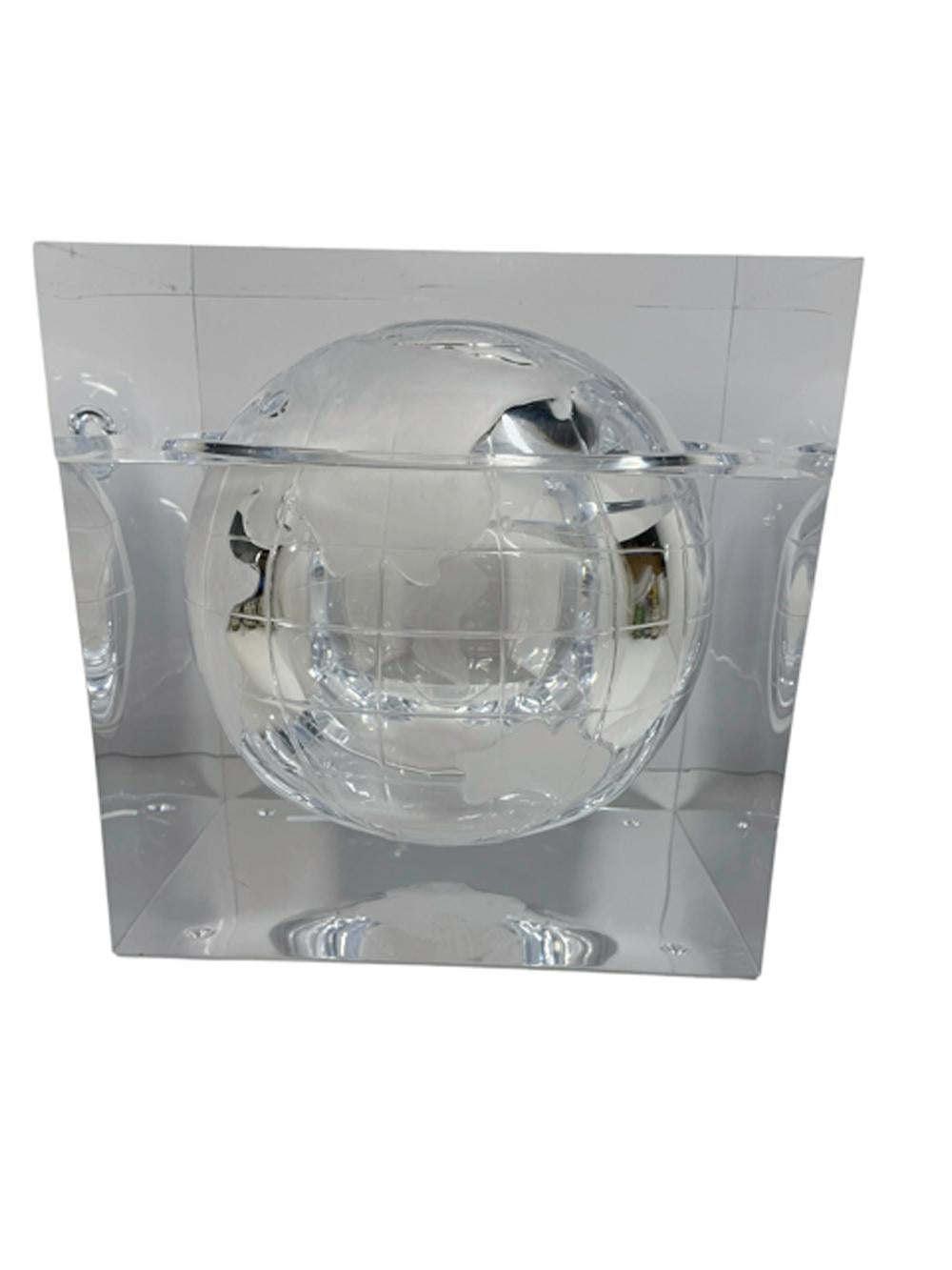 Mid-Century Modern Lucite ice bucket. Designed by Alessandro Albrizzi, designer to the Jet Set of the 1960s through early 1980s, the world globe within a Lucite cube is a design classic. The cube with lift-off lid has a spherical cavity etched with