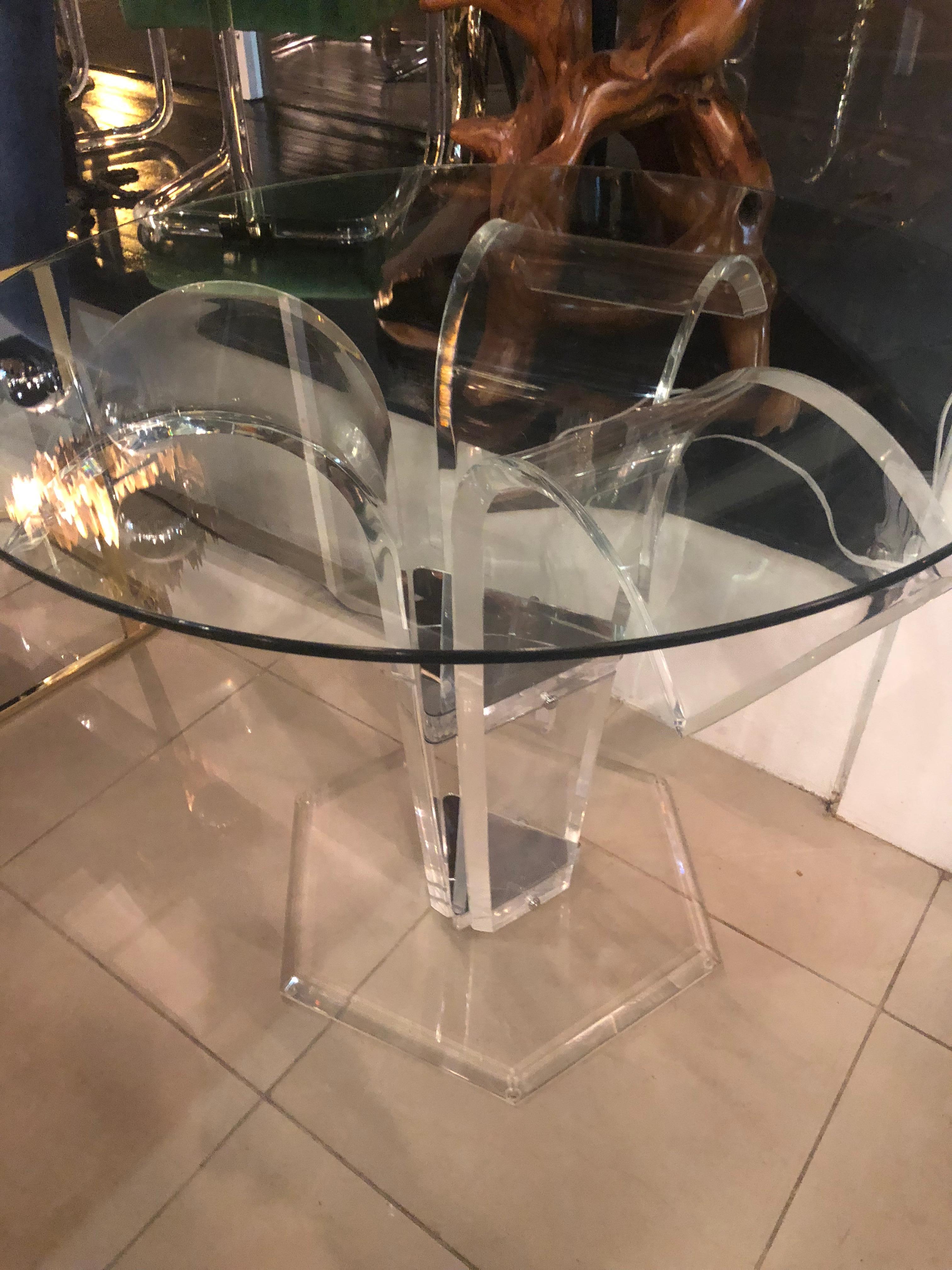 Vintage 3 flare Lucite table base. This can be used as a dining table, game table, or center entry foyer table depending on the size glass you use. Small piece of round glass is used to show as a centre table. Glass not included.