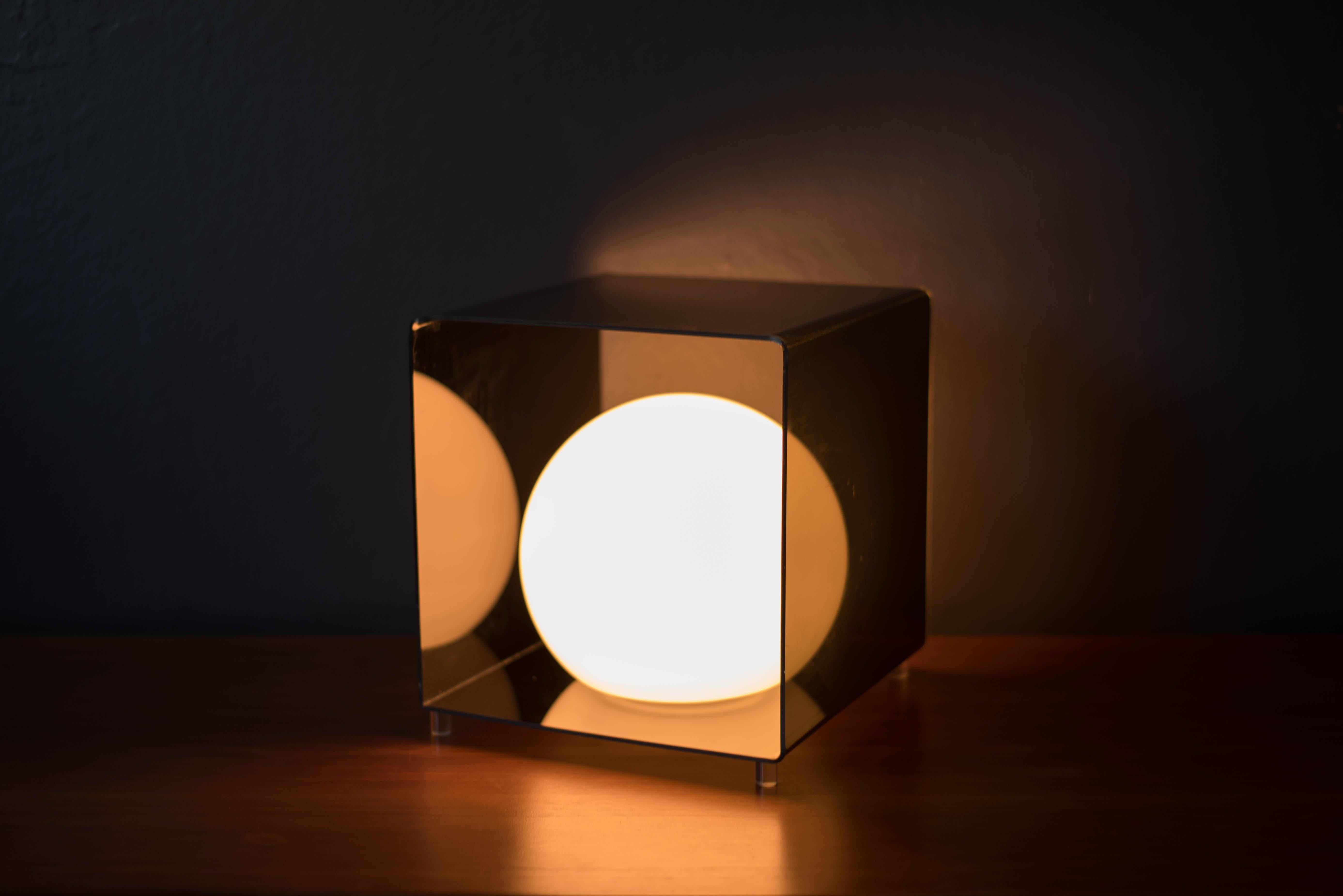 Mid century Pop Art globe lamp, circa 1970s. This space age piece is encased in a black acrylic modernist cube that emits a soft glowing light.



Offered by Mid Century Maddist