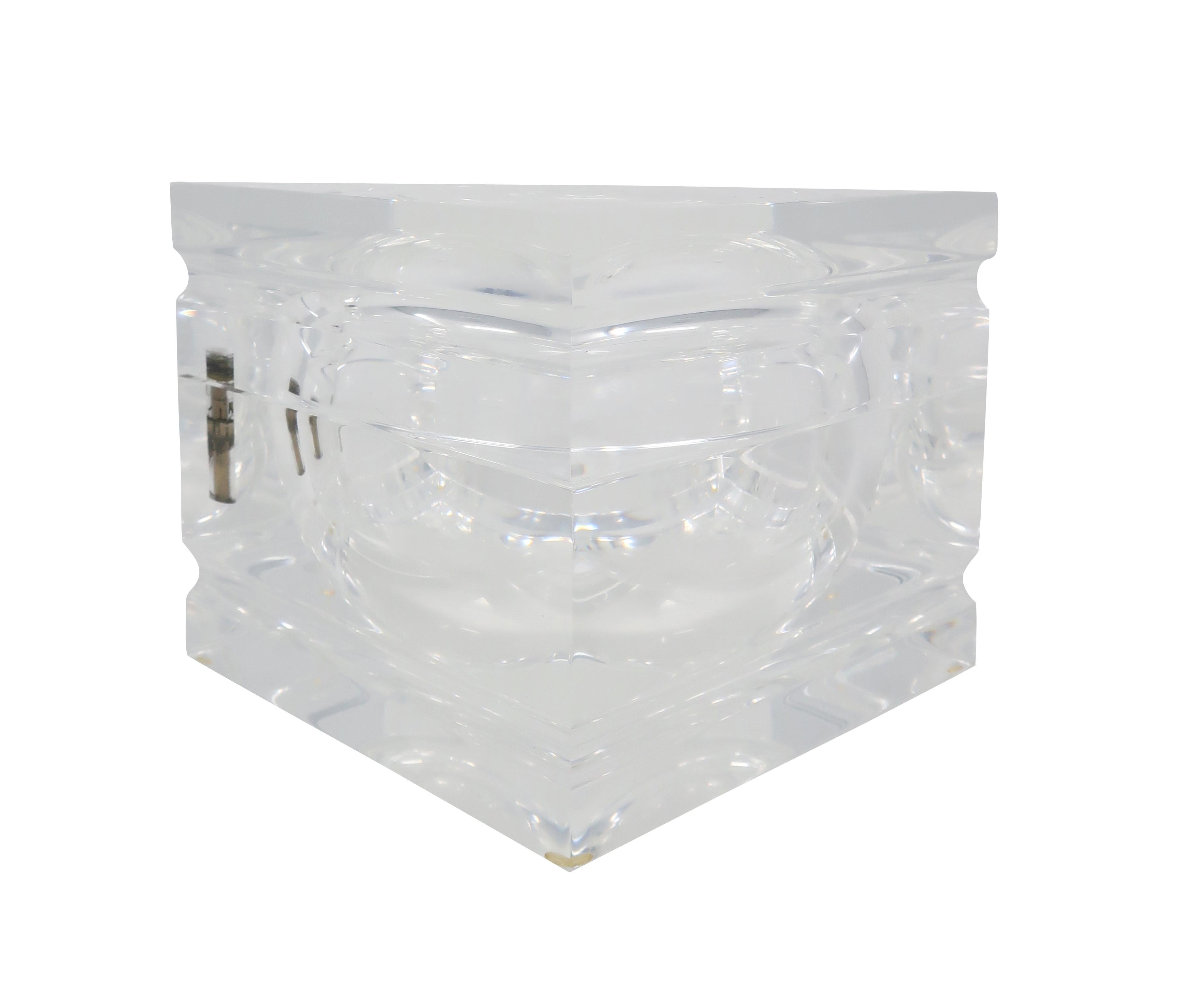 A stunning 1970s Lucite ice bucket attributed to Alessandro Albrizzi. The lid swivels on a pin to expose the ice storage within. Faceted edges that catch light beautifully. 

In very good vintage condition. Unmarked.

Measures: 6.75” x 6.75” x