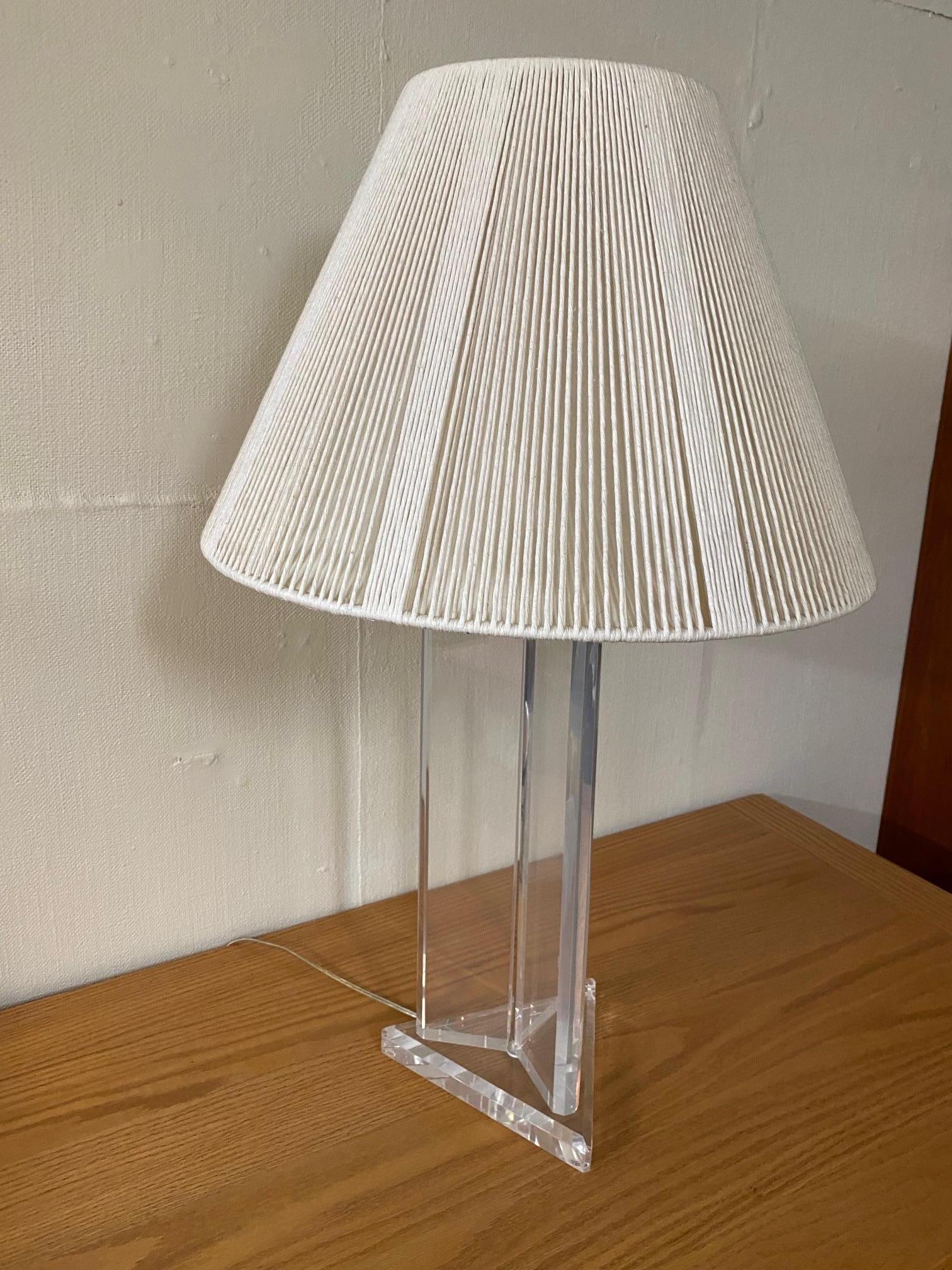 Great looking mid century modern lucite lamp with original string shade.
Lamp is 9