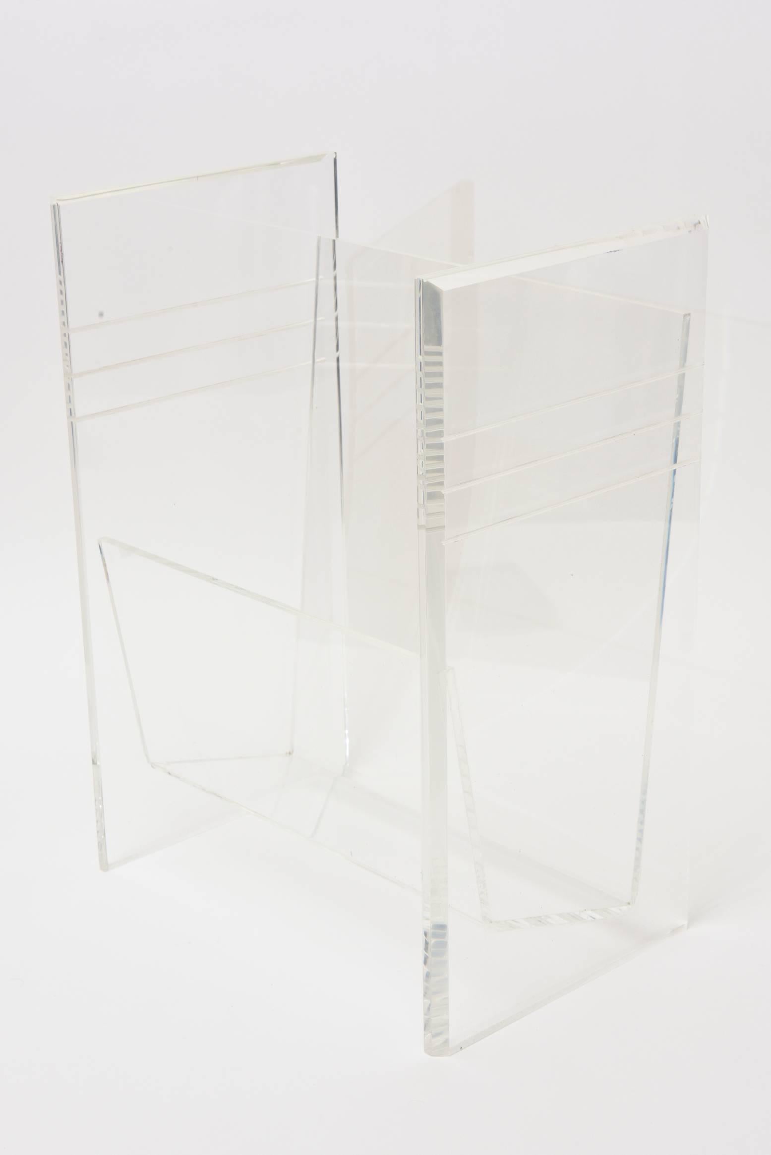 This vintage lucite magazine stand, rack or holder is sturdy and has one compartment. It is in very great condition from the 1970s. Great to place anywhere in your home or study as it will not deter from your design. Sorry the photos because of the