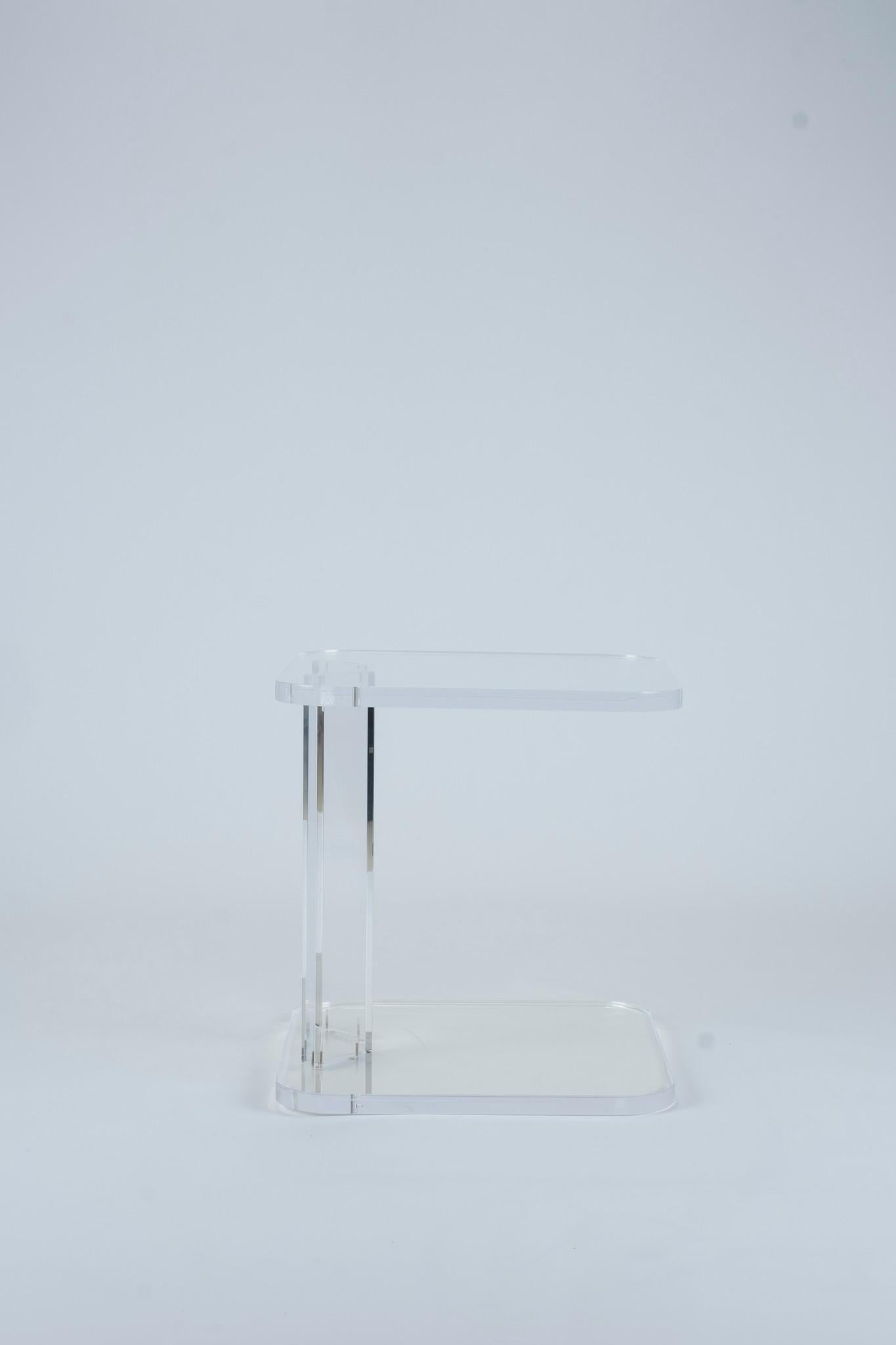 A 1970s vintage Lucite table with rounded corners made with 1