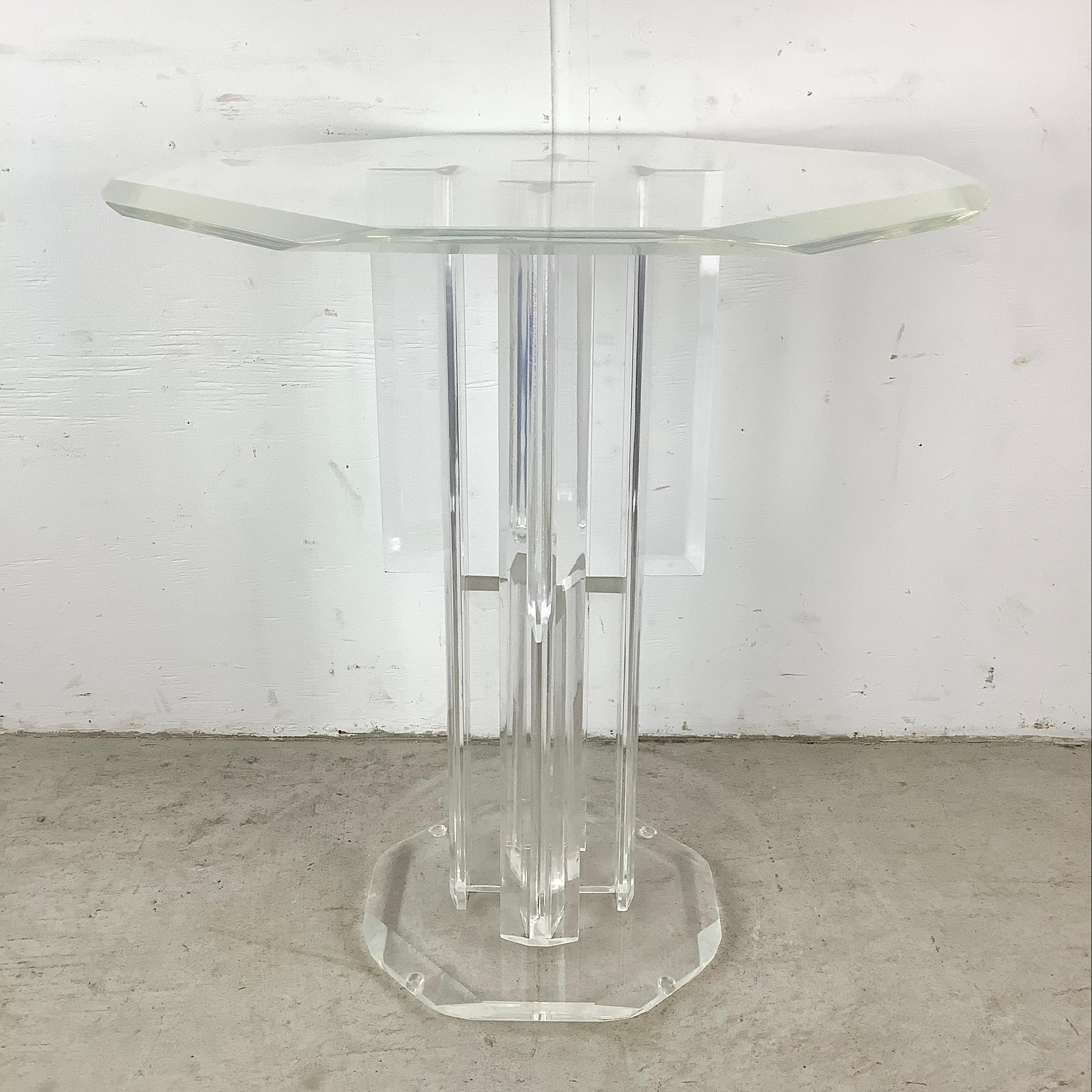 Elevate your space with this vintage lucite pedestal table, an embodiment of modern elegance and versatility. This eight-sided pedestal, crafted from high-quality lucite, shines with a clarity and sophistication unique to vintage modern furniture.
