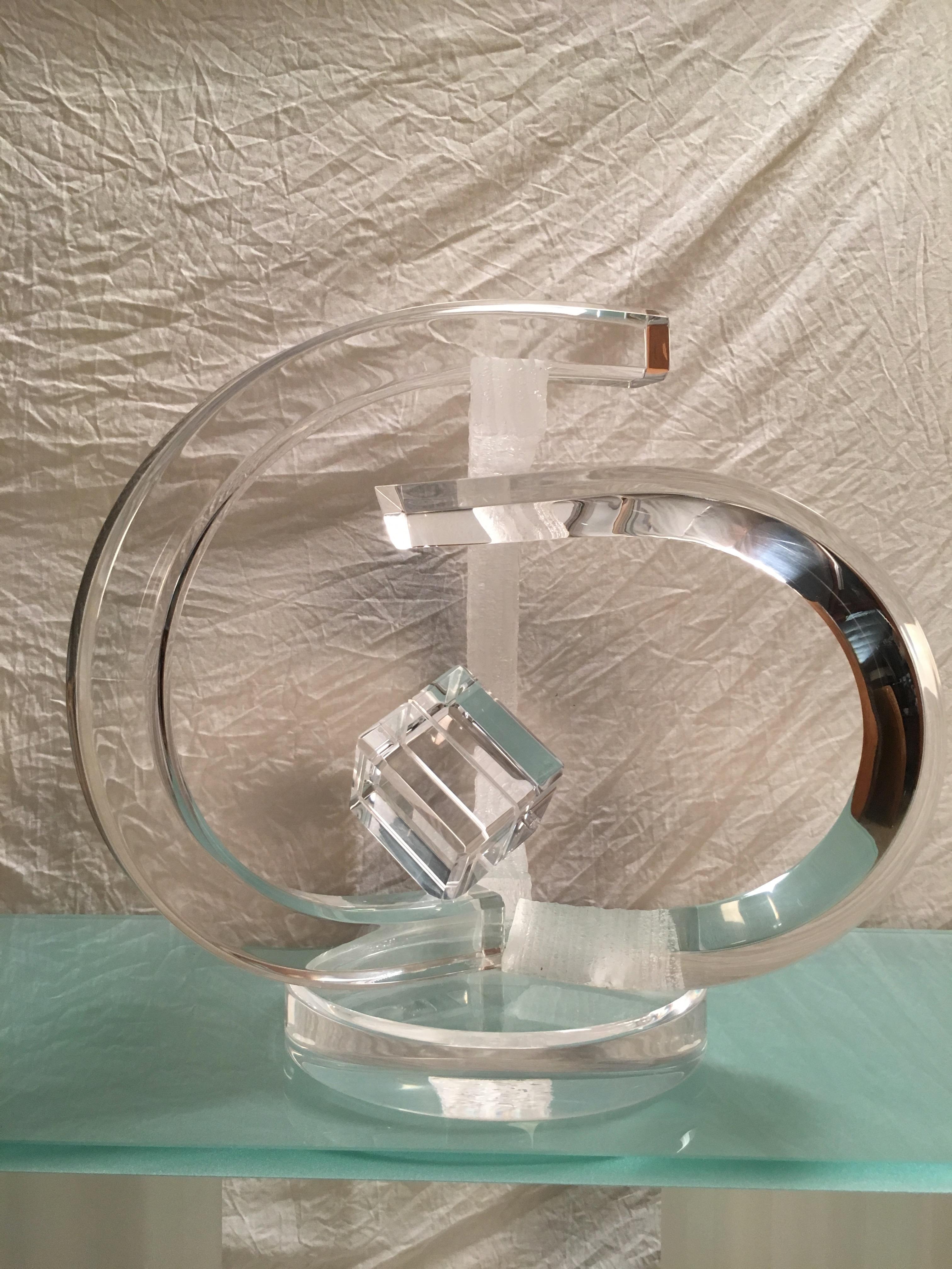 Large freeform design with a combination of chiseled Lucite and polished with a cube in the center.