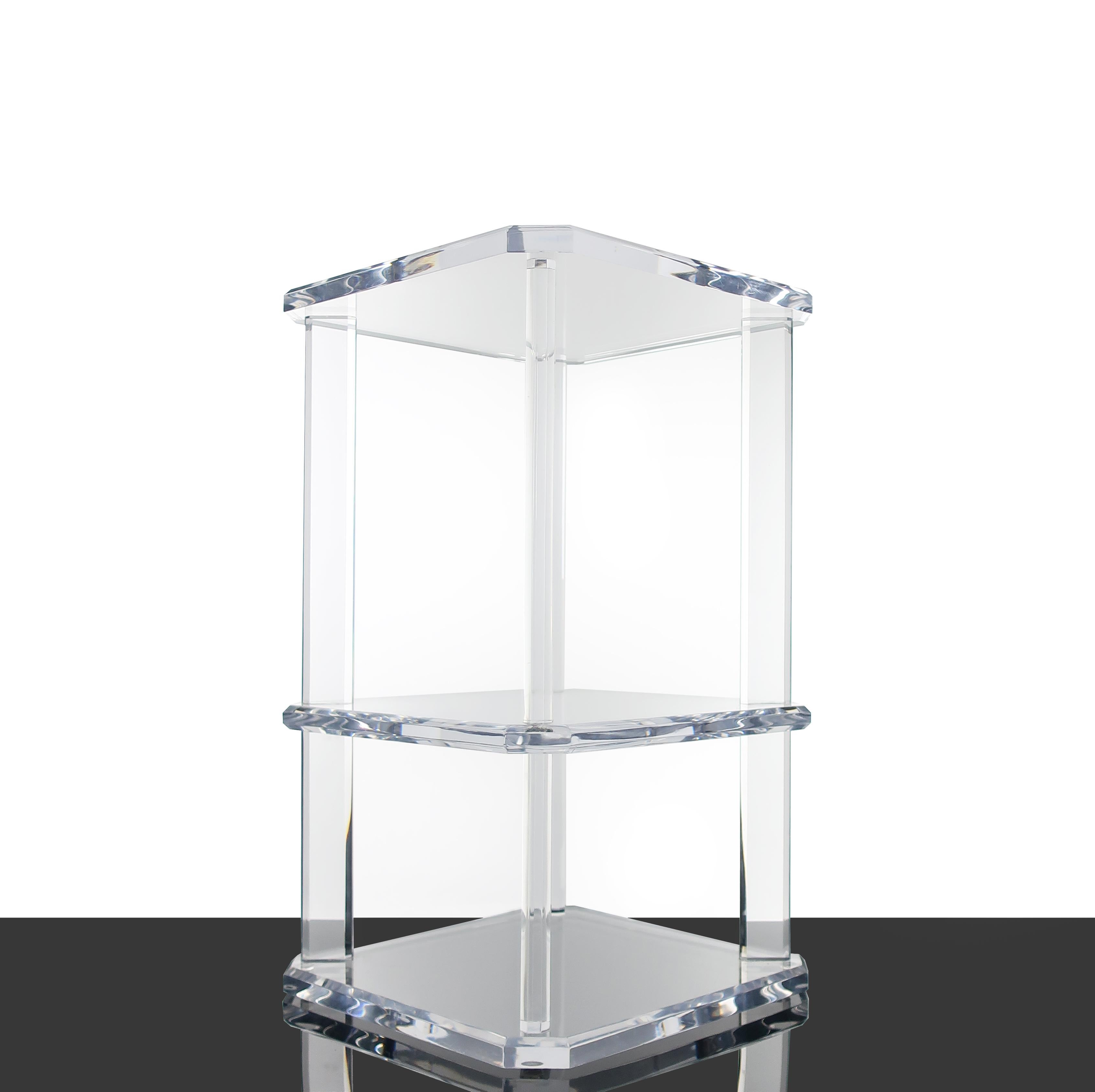 A vintage Lucite multi-shelf occasional or side table in the style of Charles Hollis Jones and Les Prismatiques. Each piece is thick and beveled, catching light beautifully yet giving it a feeling of weightlessness. Square in shape with three