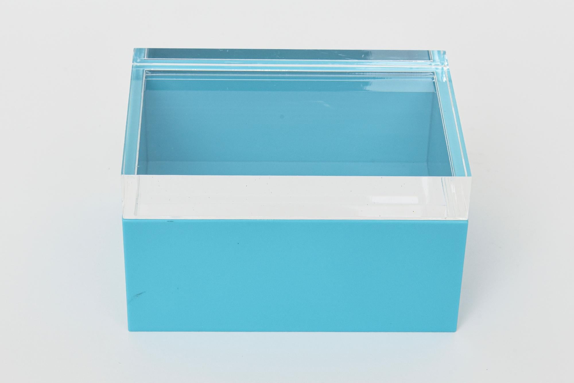 This vintage lucite 2 part lidded box is attributed to Alessandro Albrizzi and from the 70's. It is clear at the top and a gorgeous color Tiffany blue meets turquoise at the bottom portion. It makes a smashing desk accessory. In very great vintage