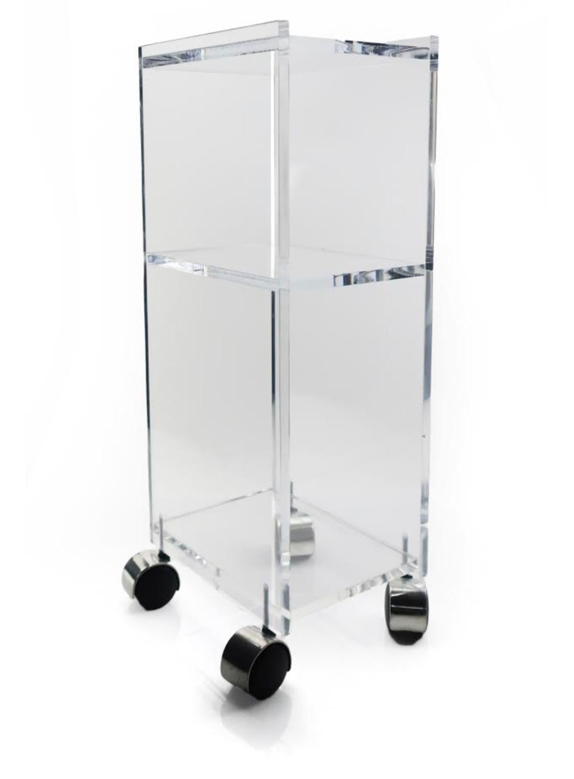 A perfect three shelf Lucite cart on casters. In excellent vintage condition.

Measures: 8