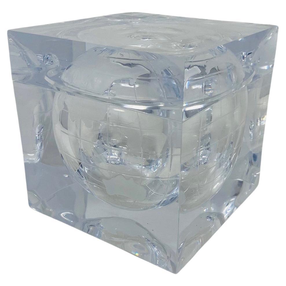 Beautiful lucite ice bucket cube depicting the world captured in a sculpture that resembles an ice cube. The effect displays a frosted world map of continents and orbiting moon. This piece was designed and created by Alessandro Albrizzi, Italy. The