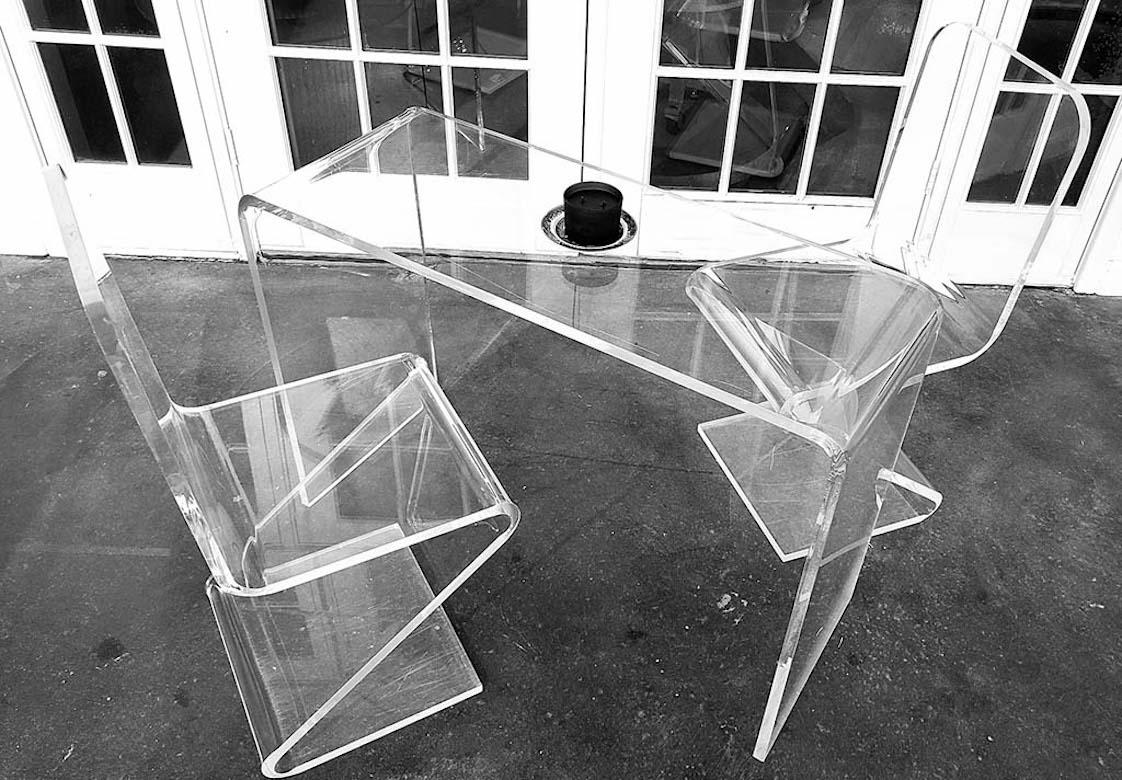 A pair of wonderfully designed lucite Z chairs that work beautifully as side chairs or desk chairs etc. They are very thick, 1