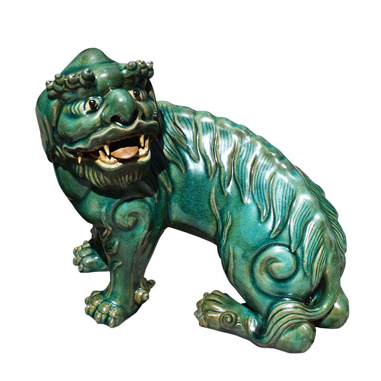 Hong Kong Vintage Lucky Chinoiserie Green Ceramic Foo Dogs or Lions, a Pair