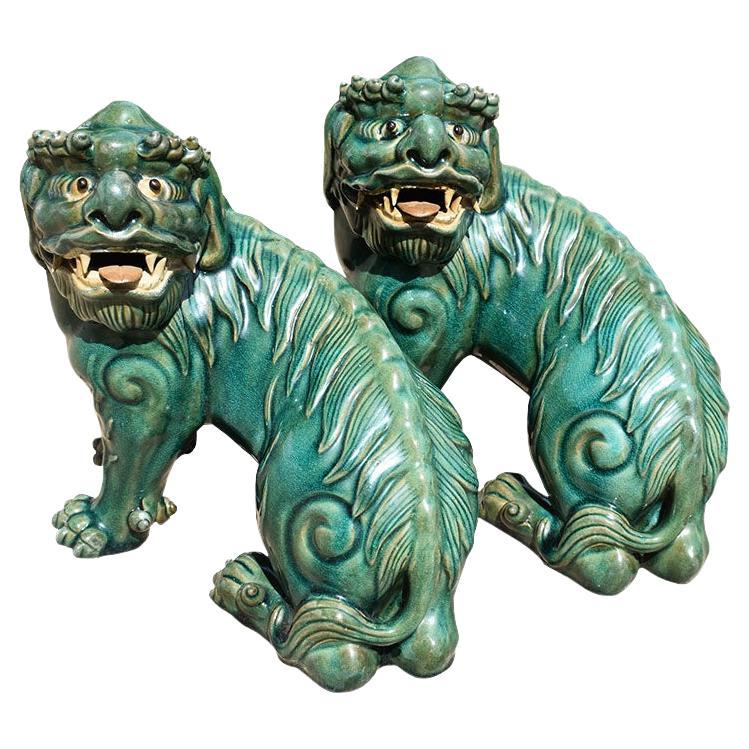Vintage Lucky Chinoiserie Green Ceramic Foo Dogs or Lions, a Pair