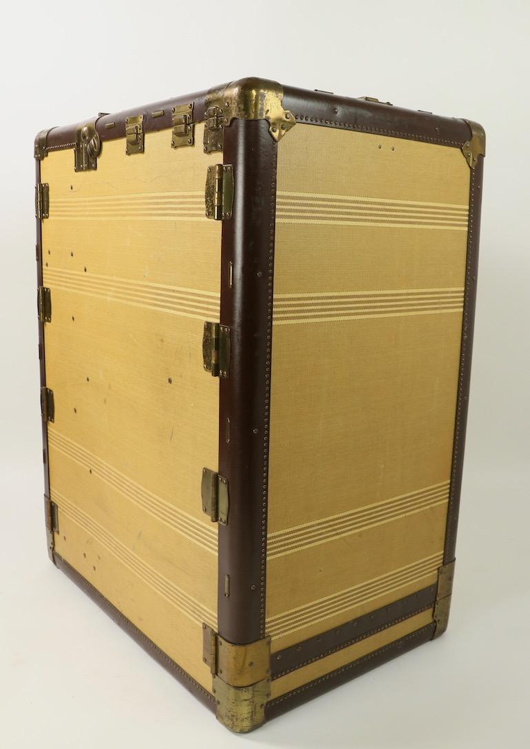 Rare  Pathfinder Imperial wardrobe luggage case on revolving base, made by Hartmann  for Saks Fifth Avenue .  The interior has a bank of drawers on one side, and accordion style  pull out  hangers on the other. Elegant, chic and stylish luggage from